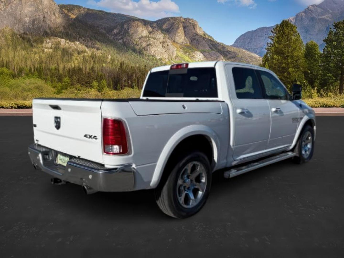 2017 Bright White Clearcoat /Black Ram 1500 Laramie Crew Cab 4x4 5'7 Box (1C6RR7NTXHS) with an HEMI 5.7L V-8 variable valve control engine, AUTOMATIC transmission, located at 1235 N Woodruff Ave., Idaho Falls, 83401, (208) 523-1053, 43.507172, -112.000488 - At Timberline Auto, finding a great deal on your next vehicle is always easy! Our experienced sales staff's goal is to help find you the right vehicle at the right price! Our knowledgeable finance department has options for almost any credit score. We offer extended service contract options to prote - Photo#3