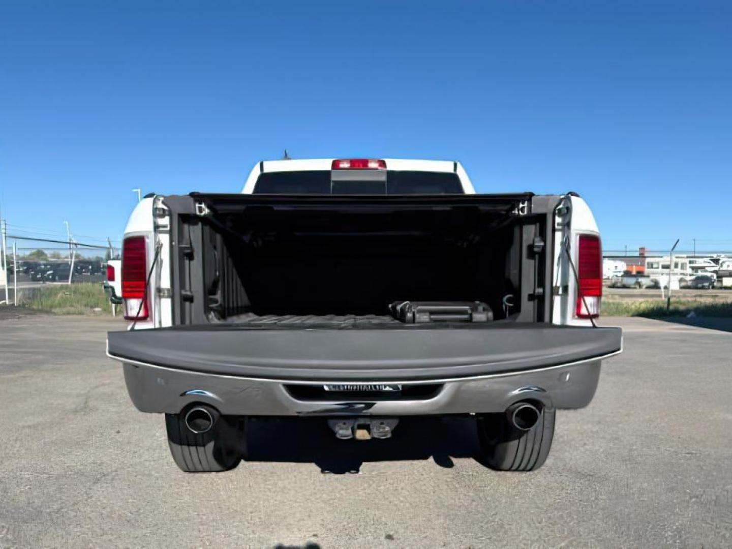 2017 Bright White Clearcoat /Black Ram 1500 Laramie Crew Cab 4x4 5'7 Box (1C6RR7NTXHS) with an HEMI 5.7L V-8 variable valve control engine, AUTOMATIC transmission, located at 1235 N Woodruff Ave., Idaho Falls, 83401, (208) 523-1053, 43.507172, -112.000488 - At Timberline Auto, finding a great deal on your next vehicle is always easy! Our experienced sales staff's goal is to help find you the right vehicle at the right price! Our knowledgeable finance department has options for almost any credit score. We offer extended service contract options to prote - Photo#5