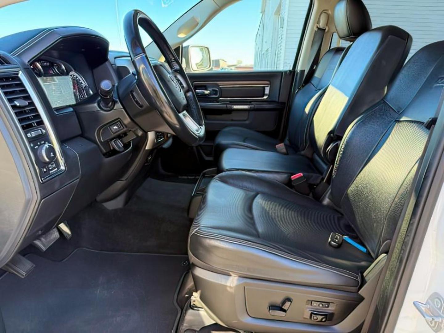 2017 Bright White Clearcoat /Black Ram 1500 Laramie Crew Cab 4x4 5'7 Box (1C6RR7NTXHS) with an HEMI 5.7L V-8 variable valve control engine, AUTOMATIC transmission, located at 1235 N Woodruff Ave., Idaho Falls, 83401, (208) 523-1053, 43.507172, -112.000488 - At Timberline Auto, finding a great deal on your next vehicle is always easy! Our experienced sales staff's goal is to help find you the right vehicle at the right price! Our knowledgeable finance department has options for almost any credit score. We offer extended service contract options to prote - Photo#11