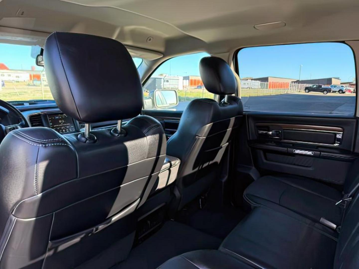 2017 Bright White Clearcoat /Black Ram 1500 Laramie Crew Cab 4x4 5'7 Box (1C6RR7NTXHS) with an HEMI 5.7L V-8 variable valve control engine, AUTOMATIC transmission, located at 1235 N Woodruff Ave., Idaho Falls, 83401, (208) 523-1053, 43.507172, -112.000488 - At Timberline Auto, finding a great deal on your next vehicle is always easy! Our experienced sales staff's goal is to help find you the right vehicle at the right price! Our knowledgeable finance department has options for almost any credit score. We offer extended service contract options to prote - Photo#20