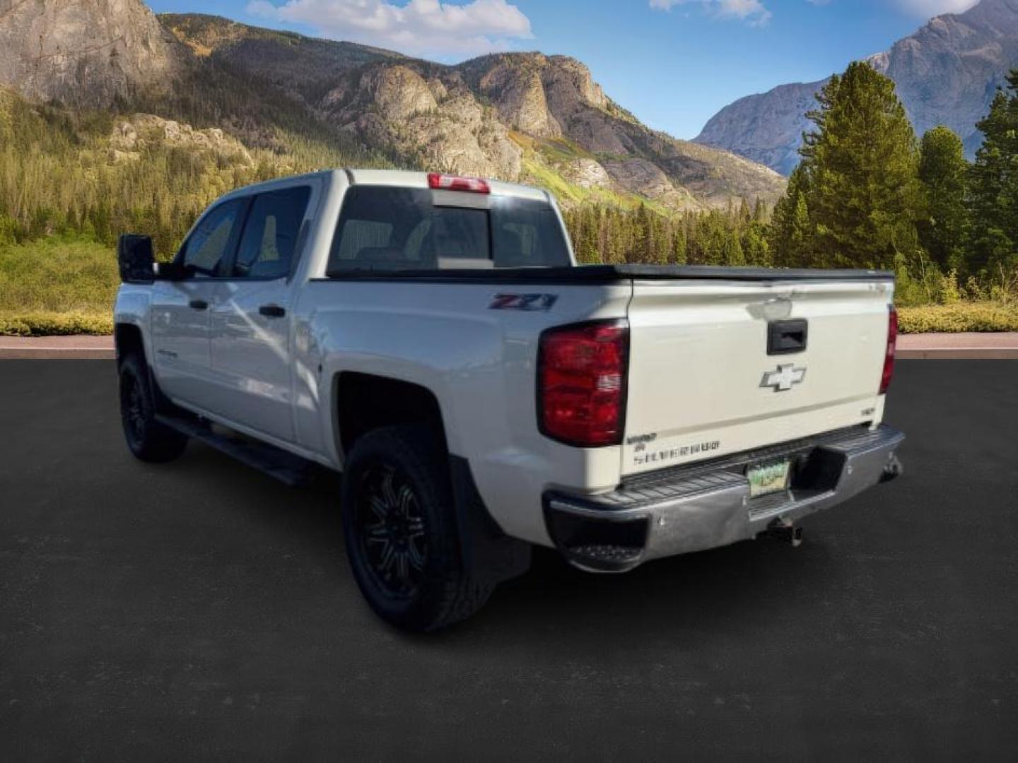2014 WHITE /Jet Black Chevrolet Silverado 1500 (3GCUKREC8EG) with an EcoTec3 53L V-8 gasoline direct injection engine, Automatic transmission, located at 1175 N Woodruff Ave, Idaho Falls, ID, 83401, 43.506901, -111.999657 - At Timberline Auto, finding a great deal on your next vehicle is always easy! Our experienced sales staff's goal is to help find you the right vehicle at the right price! Our knowledgeable finance department has options for almost any credit score. We offer extended service contract options to prote - Photo#2