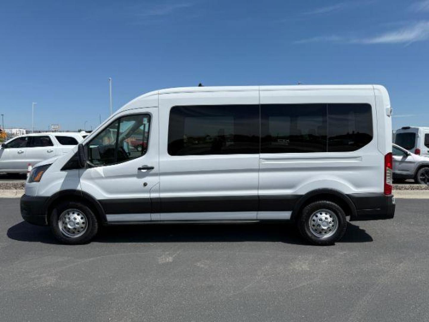 2023 Oxford White /Ebony Ford Transit-350 Passenger Van XL (1FBAX9CG1PK) with an EcoBoost 3.5L V-6 gasoline direct injection engine, AUTOMATIC transmission, located at 1235 N Woodruff Ave., Idaho Falls, 83401, (208) 523-1053, 43.507172, -112.000488 - At Timberline Auto, finding a great deal on your next vehicle is always easy! Our experienced sales staff's goal is to help find you the right vehicle at the right price! Our knowledgeable finance department has options for almost any credit score. We offer extended service contract options to prote - Photo#1