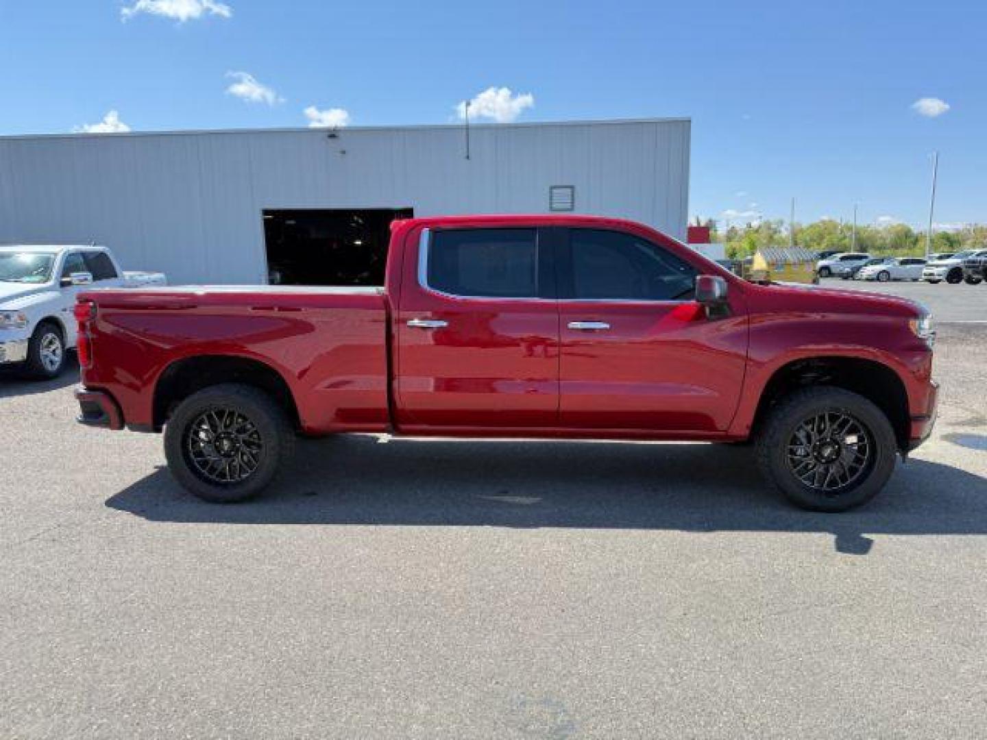 2021 Cherry Red Tintcoat /Jet Black/Umber Chevrolet Silverado 1500 4WD Crew Cab Standard Bed High Country (3GCUYHET6MG) with an Duramax 3L I-6 diesel direct injection engine, AUTOMATIC transmission, located at 1235 N Woodruff Ave., Idaho Falls, 83401, (208) 523-1053, 43.507172, -112.000488 - At Timberline Auto, finding a great deal on your next vehicle is always easy! Our experienced sales staff's goal is to help find you the right vehicle at the right price! Our knowledgeable finance department has options for almost any credit score. We offer extended service contract options to prote - Photo#6