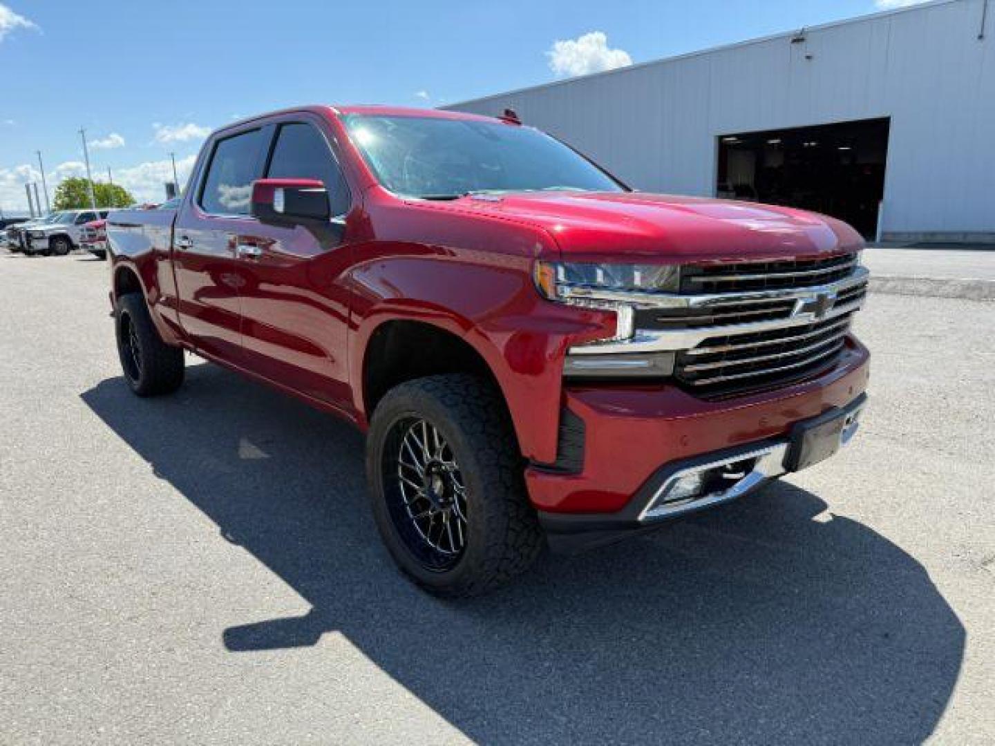 2021 Cherry Red Tintcoat /Jet Black/Umber Chevrolet Silverado 1500 4WD Crew Cab Standard Bed High Country (3GCUYHET6MG) with an Duramax 3L I-6 diesel direct injection engine, AUTOMATIC transmission, located at 1235 N Woodruff Ave., Idaho Falls, 83401, (208) 523-1053, 43.507172, -112.000488 - At Timberline Auto, finding a great deal on your next vehicle is always easy! Our experienced sales staff's goal is to help find you the right vehicle at the right price! Our knowledgeable finance department has options for almost any credit score. We offer extended service contract options to prote - Photo#7