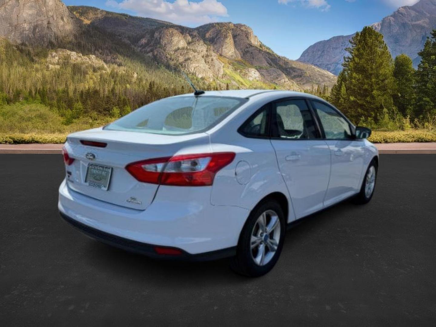 2013 Oxford White /Charcoal Black Ford Focus SE (1FADP3F27DL) with an 2L I-4 gasoline direct injection engine, AUTOMATIC transmission, located at 1235 N Woodruff Ave., Idaho Falls, 83401, (208) 523-1053, 43.507172, -112.000488 - At Timberline Auto, finding a great deal on your next vehicle is always easy! Our experienced sales staff's goal is to help find you the right vehicle at the right price! Our knowledgeable finance department has options for almost any credit score. We offer extended service contract options to prote - Photo#4