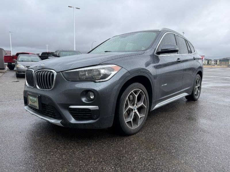 2016 Mineral Gray Metallic /Black BMW X1 xDrive28i (WBXHT3C3XG5) with an 4 Cyl, 2.0L engine, 8-speed automatic transmission, located at 1175 N Woodruff Ave, Idaho Falls, ID, 83401, 43.506901, -111.999657 - <b>Vehicle Details</b><br>Experience confident driving in this pre-owned 2016 BMW X1 xDrive28i, now available in Idaho Falls, ID. Powered by a responsive 4-cylinder, 2.0L gasoline engine and equipped with BMW xDrive AWD, this luxury compact SUV delivers balanced performance, surefooted handling, and- Photo#0