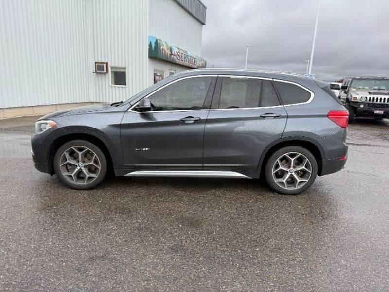 2016 Mineral Gray Metallic /Black BMW X1 xDrive28i (WBXHT3C3XG5) with an 4 Cyl, 2.0L engine, 8-speed automatic transmission, located at 1175 N Woodruff Ave, Idaho Falls, ID, 83401, 43.506901, -111.999657 - <b>Vehicle Details</b><br>Experience confident driving in this pre-owned 2016 BMW X1 xDrive28i, now available in Idaho Falls, ID. Powered by a responsive 4-cylinder, 2.0L gasoline engine and equipped with BMW xDrive AWD, this luxury compact SUV delivers balanced performance, surefooted handling, and- Photo#1