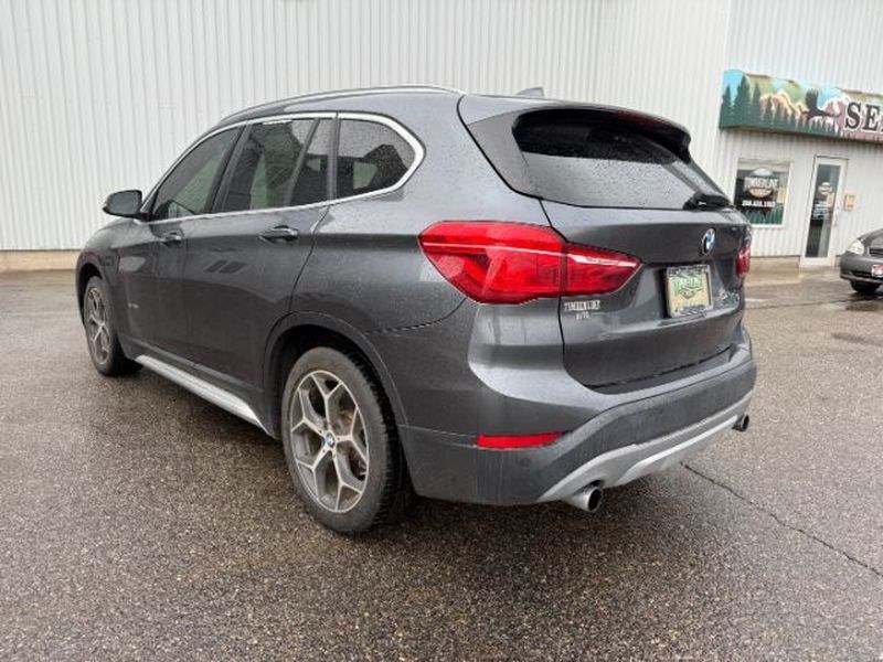 2016 Mineral Gray Metallic /Black BMW X1 xDrive28i (WBXHT3C3XG5) with an 4 Cyl, 2.0L engine, 8-speed automatic transmission, located at 1175 N Woodruff Ave, Idaho Falls, ID, 83401, 43.506901, -111.999657 - <b>Vehicle Details</b><br>Experience confident driving in this pre-owned 2016 BMW X1 xDrive28i, now available in Idaho Falls, ID. Powered by a responsive 4-cylinder, 2.0L gasoline engine and equipped with BMW xDrive AWD, this luxury compact SUV delivers balanced performance, surefooted handling, and- Photo#2