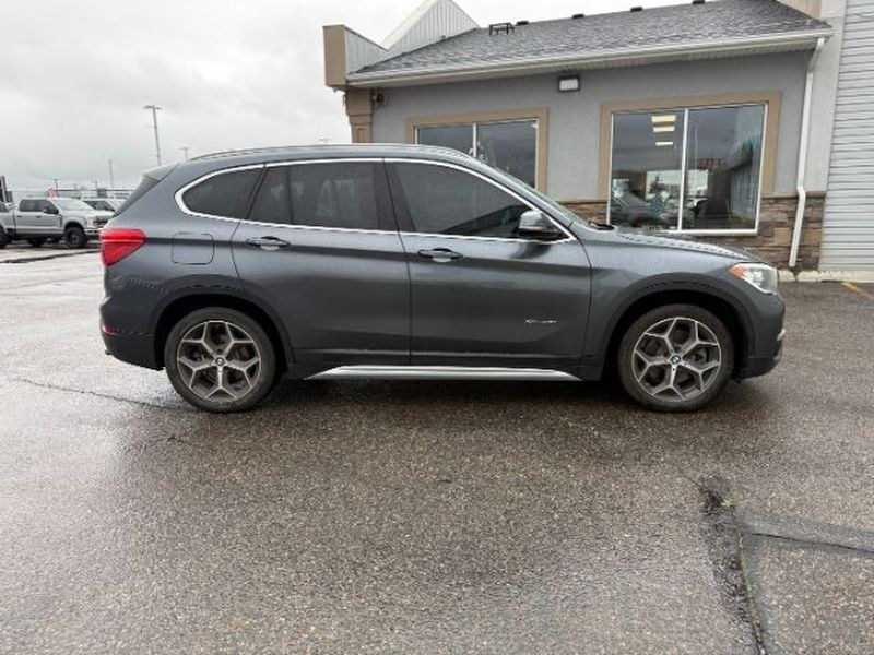 2016 Mineral Gray Metallic /Black BMW X1 xDrive28i (WBXHT3C3XG5) with an 4 Cyl, 2.0L engine, 8-speed automatic transmission, located at 1175 N Woodruff Ave, Idaho Falls, ID, 83401, 43.506901, -111.999657 - <b>Vehicle Details</b><br>Experience confident driving in this pre-owned 2016 BMW X1 xDrive28i, now available in Idaho Falls, ID. Powered by a responsive 4-cylinder, 2.0L gasoline engine and equipped with BMW xDrive AWD, this luxury compact SUV delivers balanced performance, surefooted handling, and- Photo#9