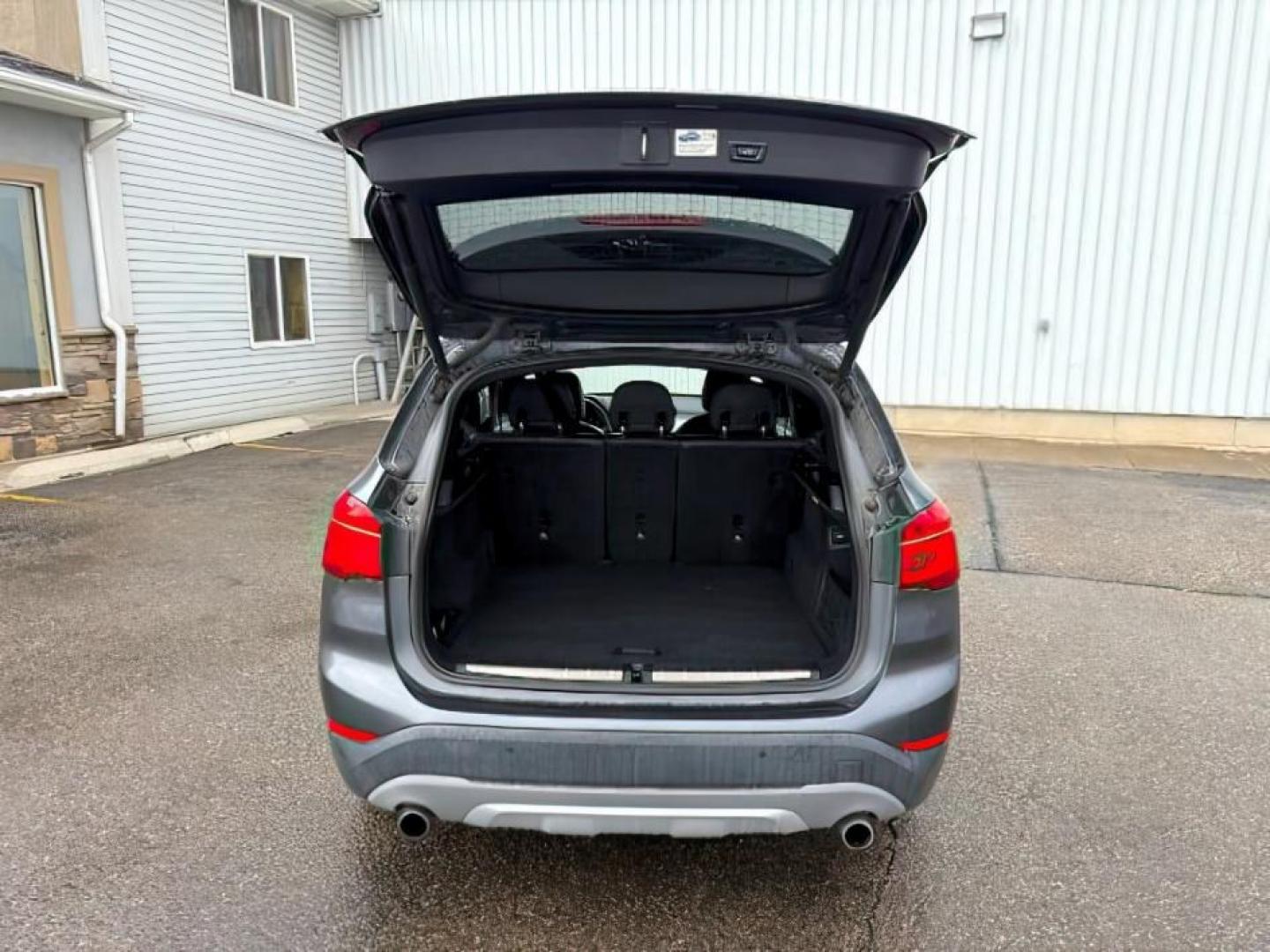 2016 BLACK /Black BMW X1 xDrive28i (WBXHT3C3XG5) with an 2L I-4 gasoline direct injection engine, AUTOMATIC transmission, located at 1235 N Woodruff Ave., Idaho Falls, 83401, (208) 523-1053, 43.507172, -112.000488 - At Timberline Auto, finding a great deal on your next vehicle is always easy! Our experienced sales staff's goal is to help find you the right vehicle at the right price! Our knowledgeable finance department has options for almost any credit score. We offer extended service contract options to prote - Photo#5