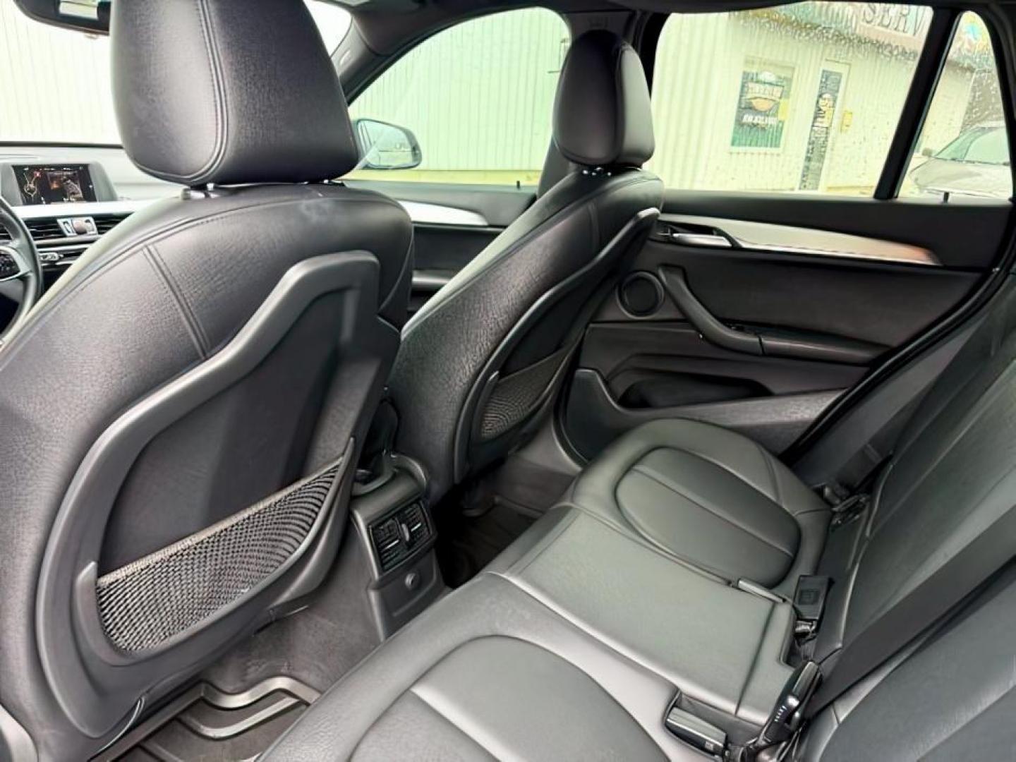 2016 BLACK /Black BMW X1 xDrive28i (WBXHT3C3XG5) with an 2L I-4 gasoline direct injection engine, AUTOMATIC transmission, located at 1235 N Woodruff Ave., Idaho Falls, 83401, (208) 523-1053, 43.507172, -112.000488 - At Timberline Auto, finding a great deal on your next vehicle is always easy! Our experienced sales staff's goal is to help find you the right vehicle at the right price! Our knowledgeable finance department has options for almost any credit score. We offer extended service contract options to prote - Photo#26