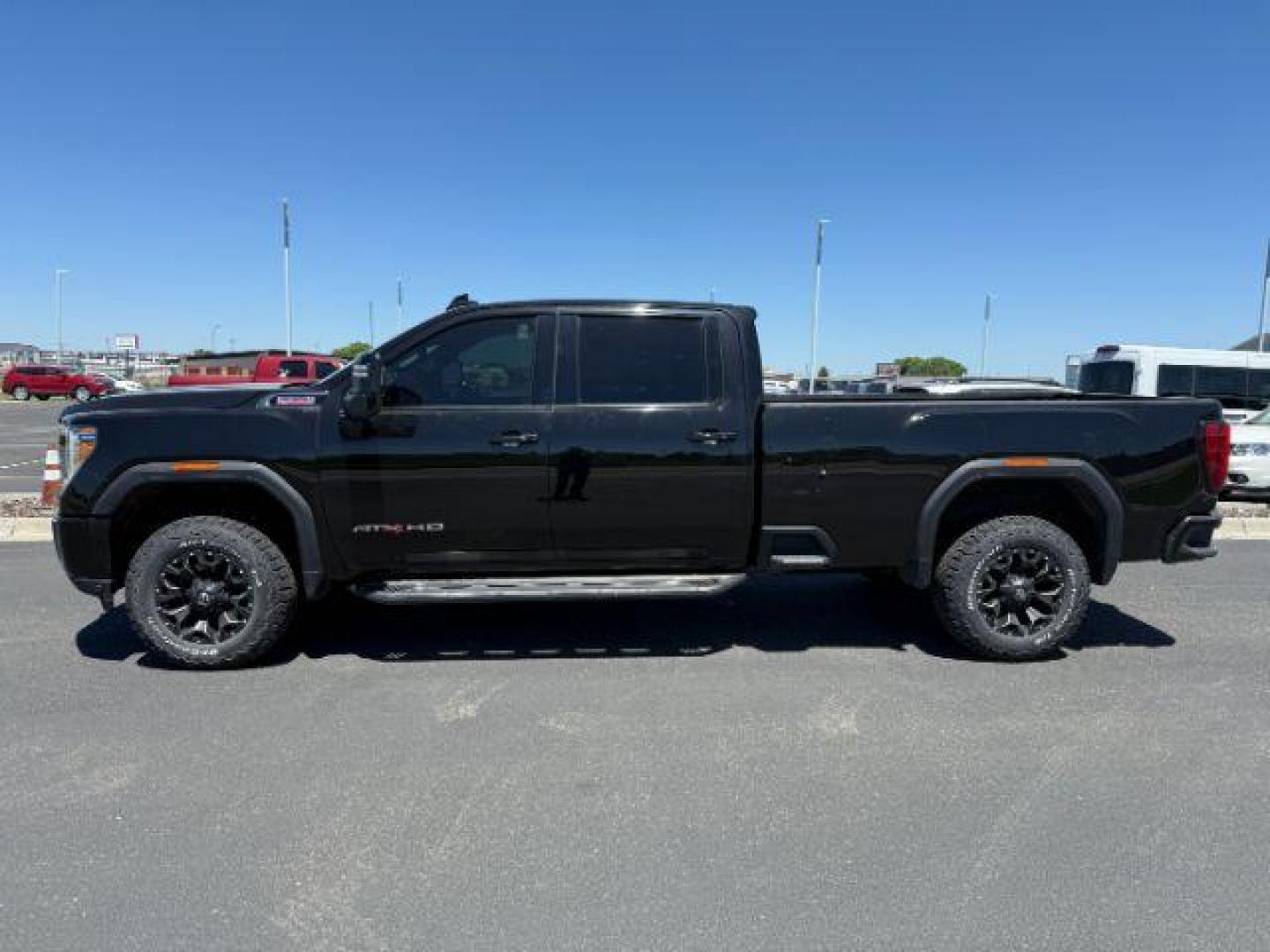 2021 Onyx Black /Jet Black w/Kalahari Accents GMC Sierra 2500HD 4WD Crew Cab Long Bed AT4 (1GT49PEY0MF) with an Duramax 6.6L V-8 diesel direct injection engine, AUTOMATIC transmission, located at 1235 N Woodruff Ave., Idaho Falls, 83401, (208) 523-1053, 43.507172, -112.000488 - At Timberline Auto, finding a great deal on your next vehicle is always easy! Our experienced sales staff's goal is to help find you the right vehicle at the right price! Our knowledgeable finance department has options for almost any credit score. We offer extended service contract options to prote - Photo#0