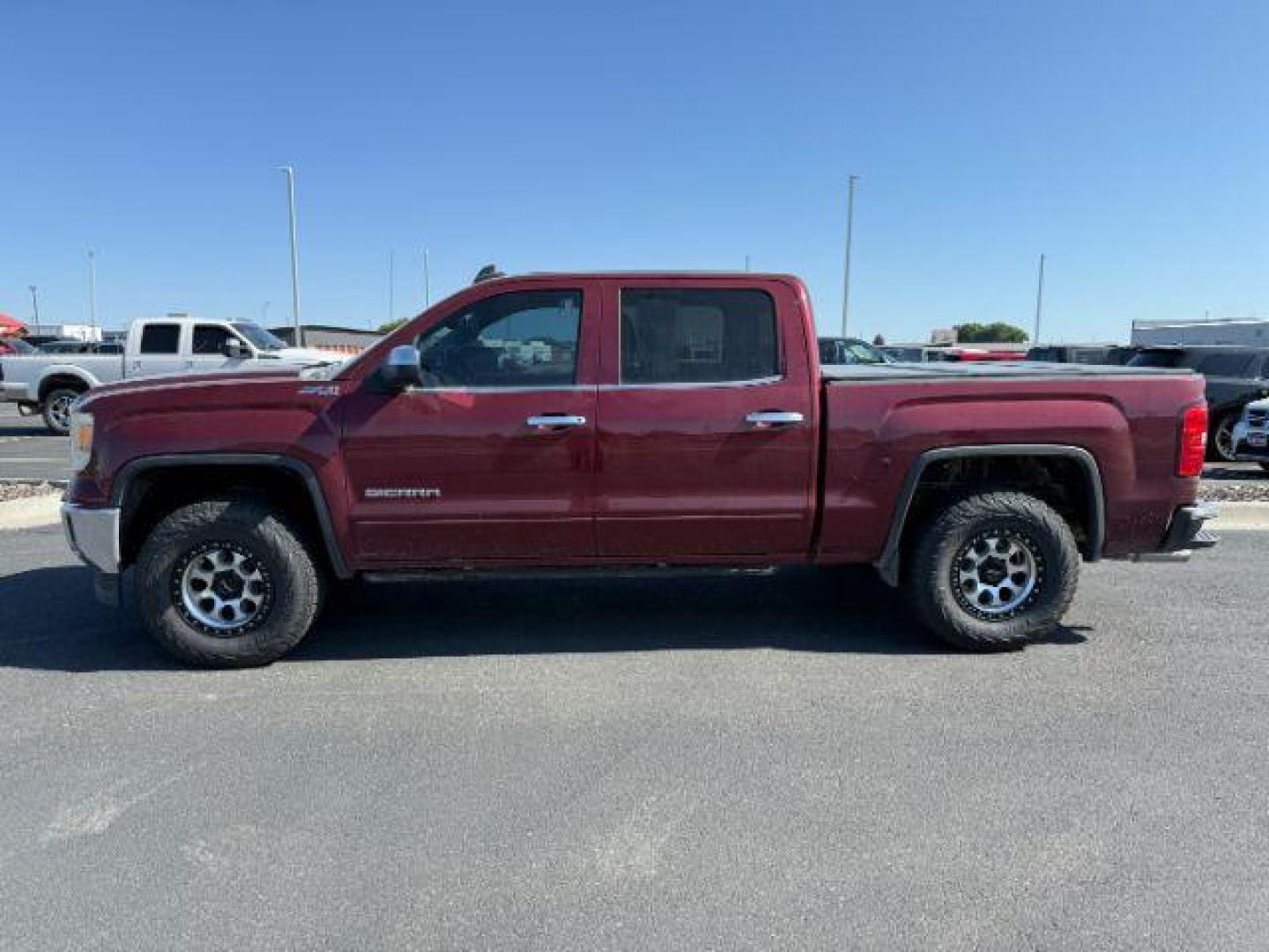 2015 MAROON /Jet Black GMC Sierra 1500 SLE (3GTU2UEC5FG) with an 5.3 VORTEC engine, AUTOMATIC transmission, located at 1235 N Woodruff Ave., Idaho Falls, 83401, (208) 523-1053, 43.507172, -112.000488 - At Timberline Auto, finding a great deal on your next vehicle is always easy! Our experienced sales staff's goal is to help find you the right vehicle at the right price! Our knowledgeable finance department has options for almost any credit score. We offer extended service contract options to prote - Photo#0