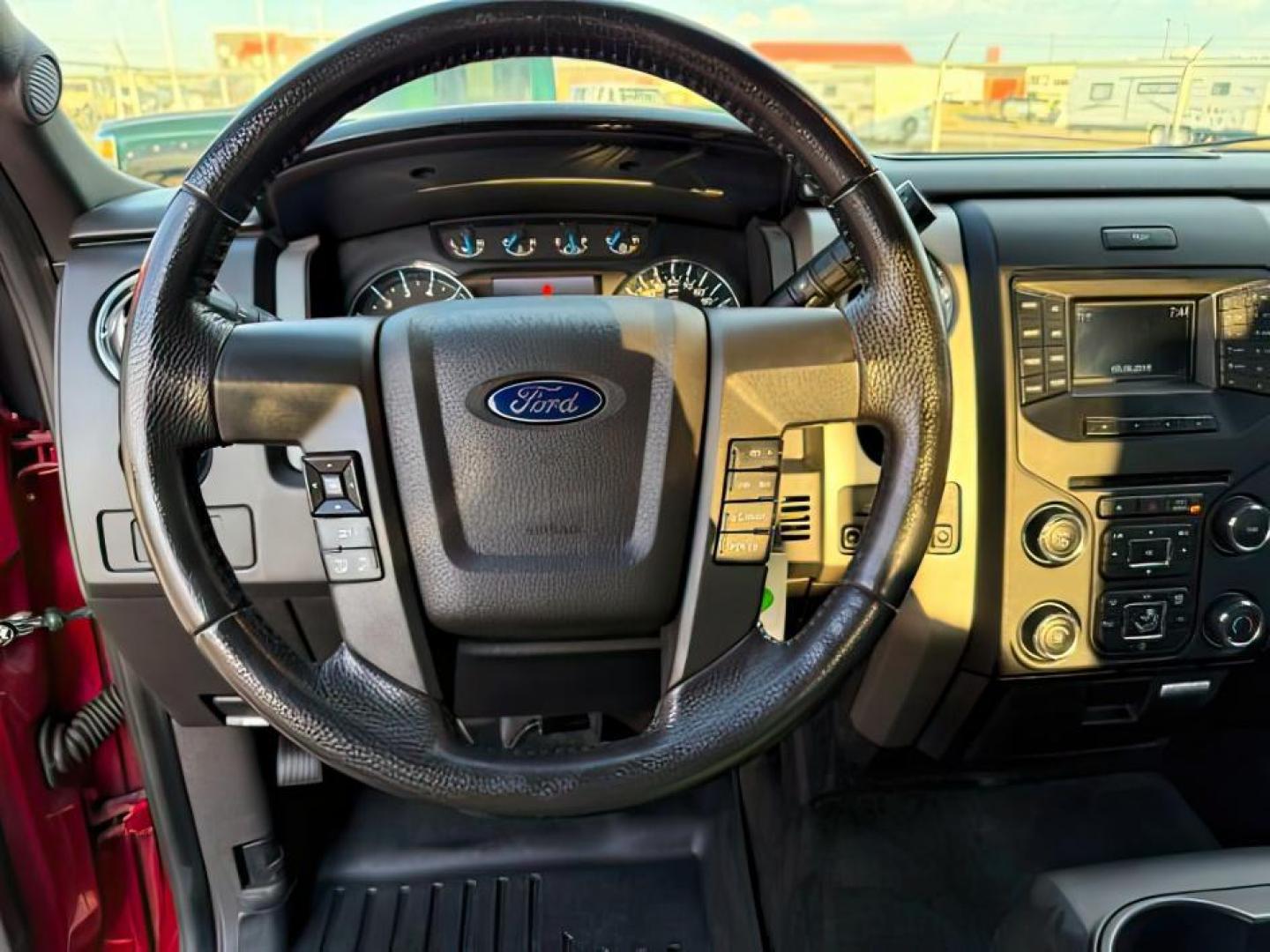 2014 Ruby Red Metallic Tinted Clearcoat /Steel Gray Ford F-150 (1FTFW1ET5EK) with an EcoBoost 35L V-6 gasoline direct injection engine, Automatic transmission, located at 1175 N Woodruff Ave, Idaho Falls, ID, 83401, 43.506901, -111.999657 - At Timberline Auto, finding a great deal on your next vehicle is always easy! Our experienced sales staff's goal is to help find you the right vehicle at the right price! Our knowledgeable finance department has options for almost any credit score. We offer extended service contract options to prote - Photo#13