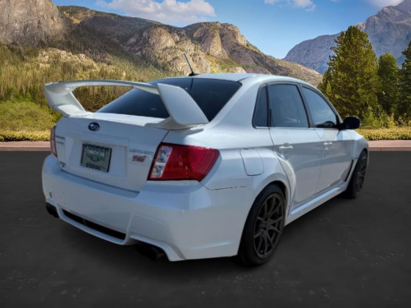 2014 Satin White Pearl /Black Subaru Impreza WRX STI (JF1GV8J60EL) with an 2.5L H-4 DOHC engine, MANUAL transmission, located at 1235 N Woodruff Ave., Idaho Falls, 83401, (208) 523-1053, 43.507172, -112.000488 - At Timberline Auto, finding a great deal on your next vehicle is always easy! Our experienced sales staff's goal is to help find you the right vehicle at the right price! Our knowledgeable finance department has options for almost any credit score. We offer extended service contract options to prote - Photo#4