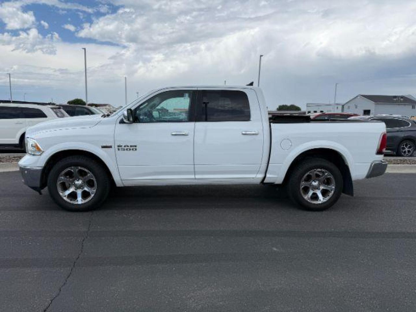 2018 Pearl White /Black Ram 1500 Laramie Crew Cab 4x4 5'7 Box (1C6RR7NT1JS) with an HEMI 5.7L V-8 variable valve control engine, AUTOMATIC transmission, located at 1235 N Woodruff Ave., Idaho Falls, 83401, (208) 523-1053, 43.507172, -112.000488 - At Timberline Auto, finding a great deal on your next vehicle is always easy! Our experienced sales staff's goal is to help find you the right vehicle at the right price! Our knowledgeable finance department has options for almost any credit score. We offer extended service contract options to prote - Photo#1