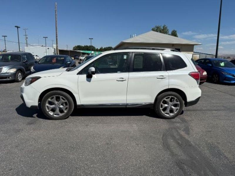 2017 Crystal White Pearl /Saddle Brown Subaru Forester Touring (JF2SJATC9HH) with an 4 Cyl, 2.5L engine, 6-speed CVT transmission, located at 1175 N Woodruff Ave, Idaho Falls, ID, 83401, 43.506901, -111.999657 - <b>Vehicle Details</b><br>Looking for a versatile pre-owned SUV in Idaho Falls, ID? This 2017 Subaru Forester 2.5i Touring AWD is a smart choice for drivers who want capability, comfort, and confidence in changing road conditions. Powered by a 4-cylinder 2.5L gasoline engine, this Subaru Forester de- Photo#1