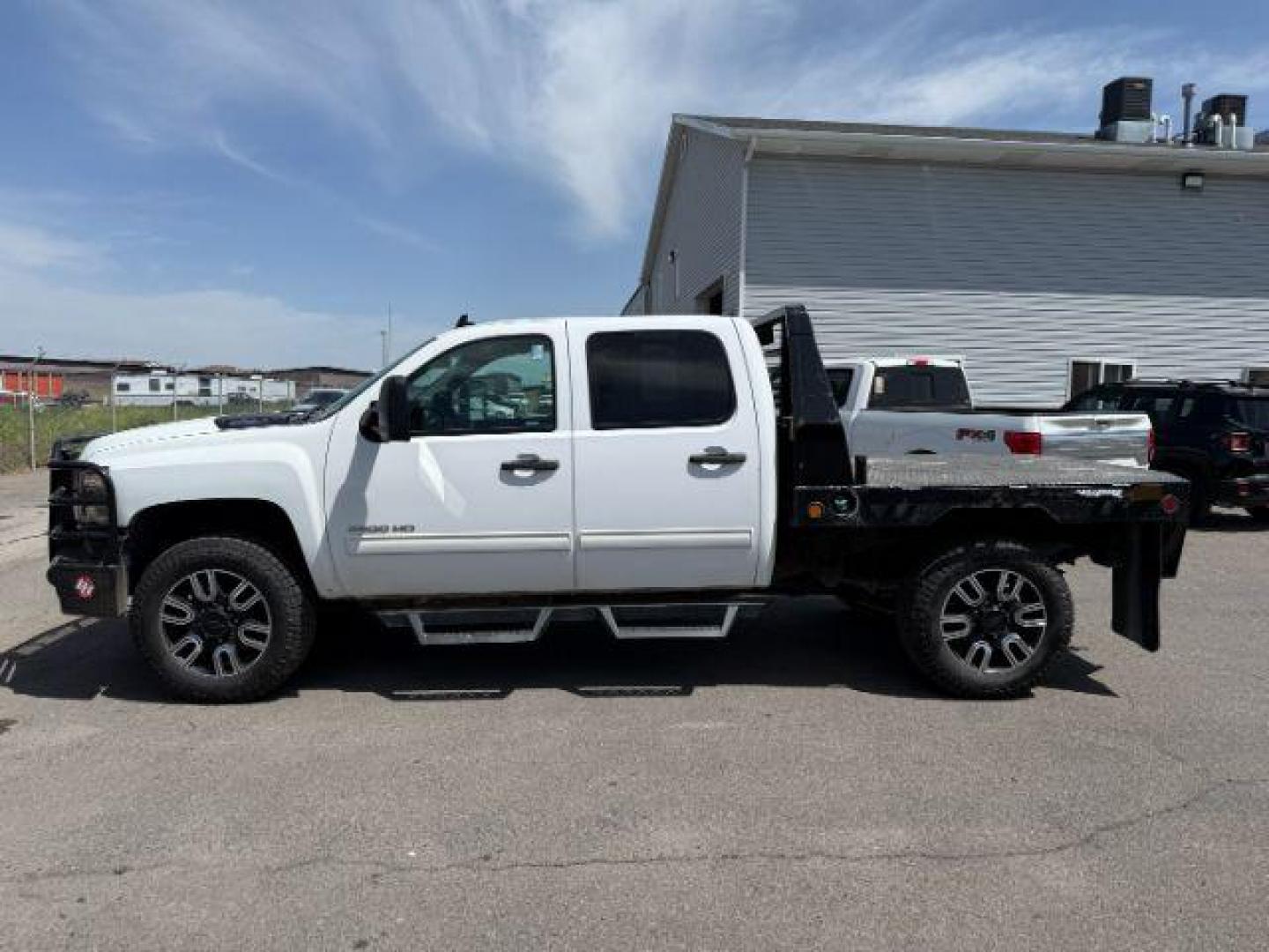 2014 Summit White /Ebony Chevrolet Silverado 2500HD (1GC1KXC84EF) with an Duramax 66L V-8 diesel direct injection engine, Automatic transmission, located at 1175 N Woodruff Ave, Idaho Falls, ID, 83401, 43.506901, -111.999657 - At Timberline Auto, finding a great deal on your next vehicle is always easy! Our experienced sales staff's goal is to help find you the right vehicle at the right price! Our knowledgeable finance department has options for almost any credit score. We offer extended service contract options to prote - Photo#1