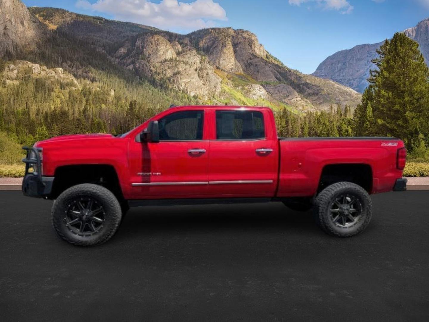 2015 Victory Red /Jet Black Chevrolet Silverado 2500HD LTZ (1GC1KWE83FF) with an 6.6 engine, AUTOMATIC transmission, located at 1235 N Woodruff Ave., Idaho Falls, 83401, (208) 523-1053, 43.507172, -112.000488 - At Timberline Auto, finding a great deal on your next vehicle is always easy! Our experienced sales staff's goal is to help find you the right vehicle at the right price! Our knowledgeable finance department has options for almost any credit score. We offer extended service contract options to prote - Photo#0