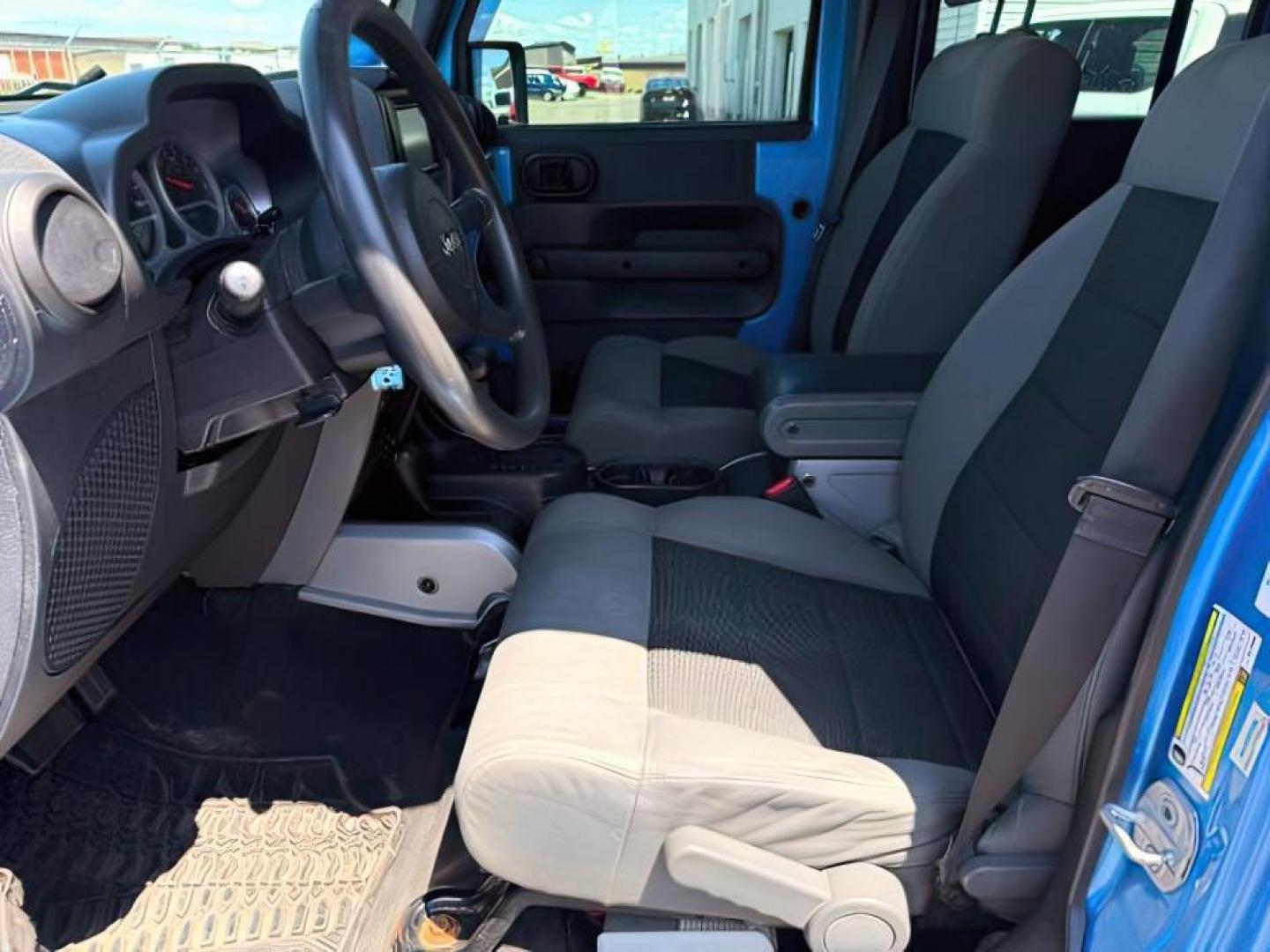 2010 BLUE /Dark Slate Gray/Med Slate Gray Jeep Wrangler Unlimited (1J4BA3H18AL) with an 38L V-6 regular unleaded engine, Automatic transmission, located at 1175 N Woodruff Ave, Idaho Falls, ID, 83401, 43.506901, -111.999657 - At Timberline Auto, finding a great deal on your next vehicle is always easy! Our experienced sales staff's goal is to help find you the right vehicle at the right price! Our knowledgeable finance department has options for almost any credit score. We offer extended service contract options to prote - Photo#9