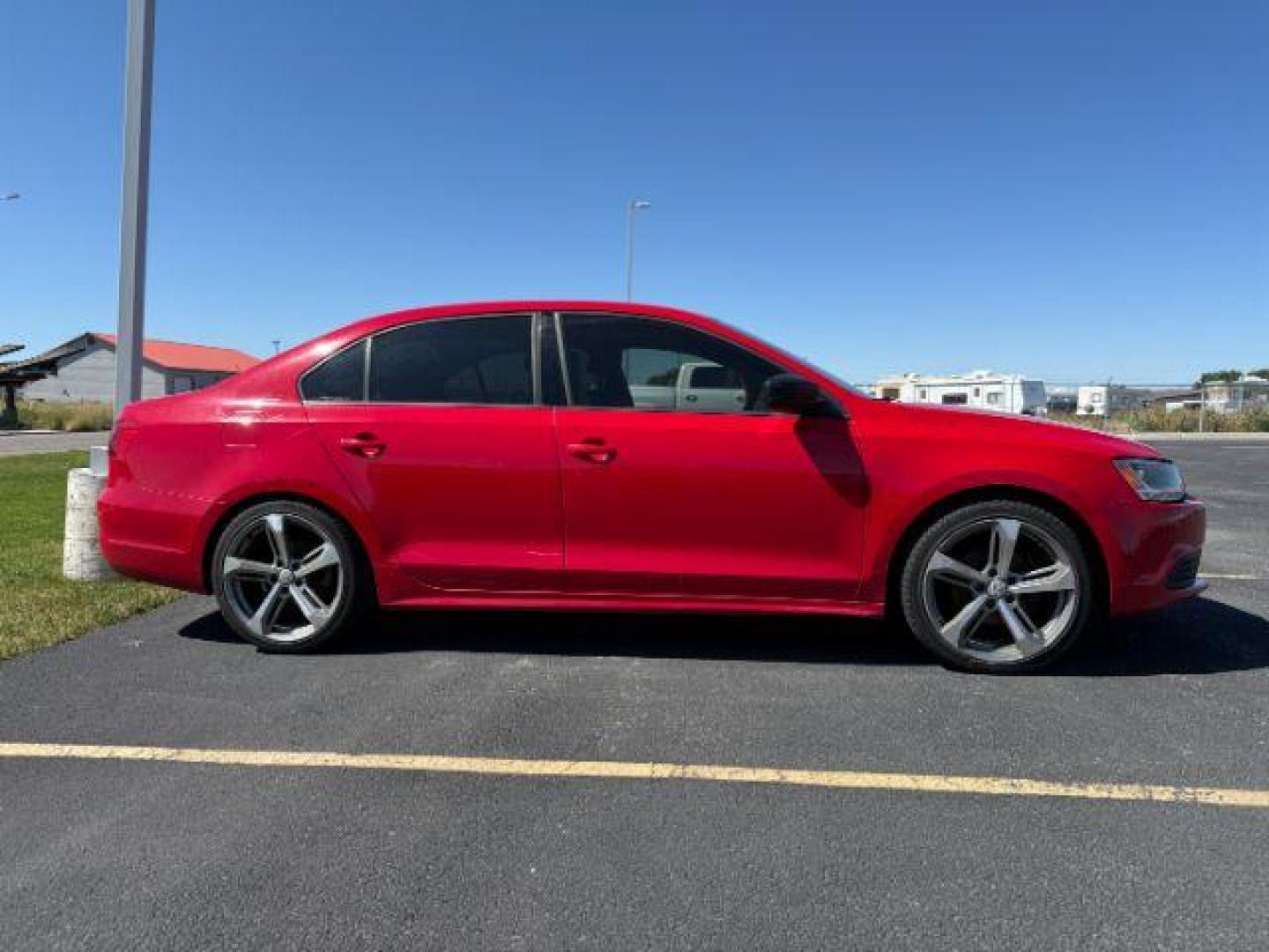 2014 Tornado Red /Titan Black Volkswagen Jetta (3VW2K7AJ5EM) with an 2L I-4 regular unleaded engine, Automatic transmission, located at 1175 N Woodruff Ave, Idaho Falls, ID, 83401, 43.506901, -111.999657 - At Timberline Auto, finding a great deal on your next vehicle is always easy! Our experienced sales staff's goal is to help find you the right vehicle at the right price! Our knowledgeable finance department has options for almost any credit score. We offer extended service contract options to prote - Photo#1