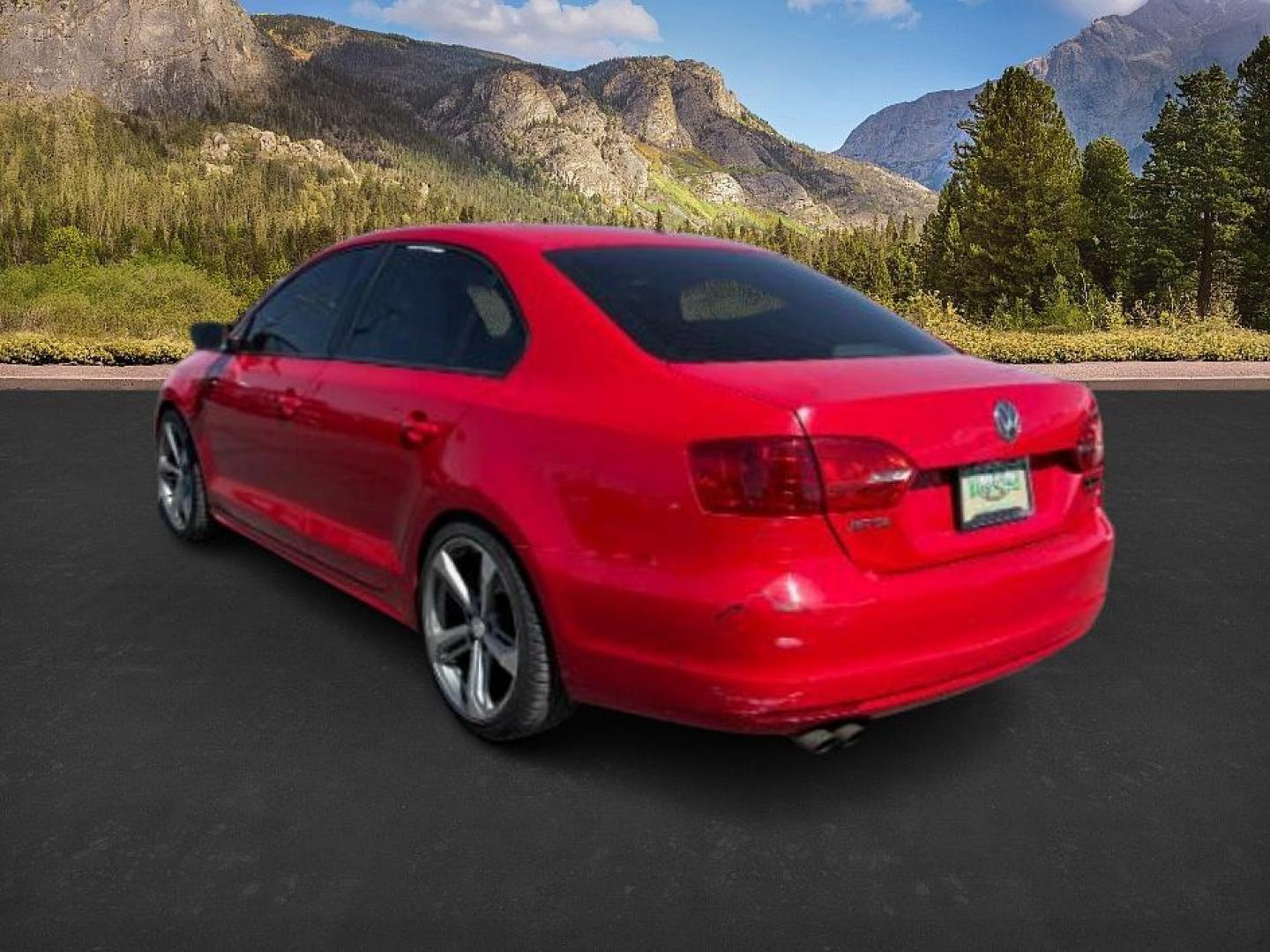 2014 Tornado Red /Titan Black Volkswagen Jetta (3VW2K7AJ5EM) with an 2L I-4 regular unleaded engine, Automatic transmission, located at 1175 N Woodruff Ave, Idaho Falls, ID, 83401, 43.506901, -111.999657 - At Timberline Auto, finding a great deal on your next vehicle is always easy! Our experienced sales staff's goal is to help find you the right vehicle at the right price! Our knowledgeable finance department has options for almost any credit score. We offer extended service contract options to prote - Photo#2
