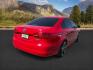 2014 Tornado Red /Titan Black Volkswagen Jetta (3VW2K7AJ5EM) with an 2L I-4 regular unleaded engine, Automatic transmission, located at 1175 N Woodruff Ave, Idaho Falls, ID, 83401, 43.506901, -111.999657 - At Timberline Auto, finding a great deal on your next vehicle is always easy! Our experienced sales staff's goal is to help find you the right vehicle at the right price! Our knowledgeable finance department has options for almost any credit score. We offer extended service contract options to prote - Photo#4
