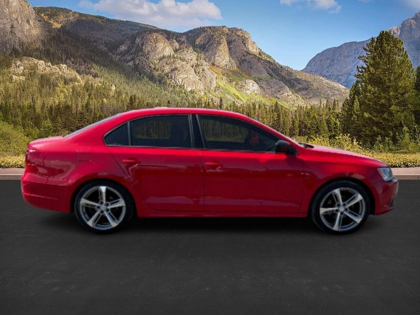 2014 Tornado Red /Titan Black Volkswagen Jetta (3VW2K7AJ5EM) with an 2L I-4 regular unleaded engine, Automatic transmission, located at 1175 N Woodruff Ave, Idaho Falls, ID, 83401, 43.506901, -111.999657 - At Timberline Auto, finding a great deal on your next vehicle is always easy! Our experienced sales staff's goal is to help find you the right vehicle at the right price! Our knowledgeable finance department has options for almost any credit score. We offer extended service contract options to prote - Photo#5
