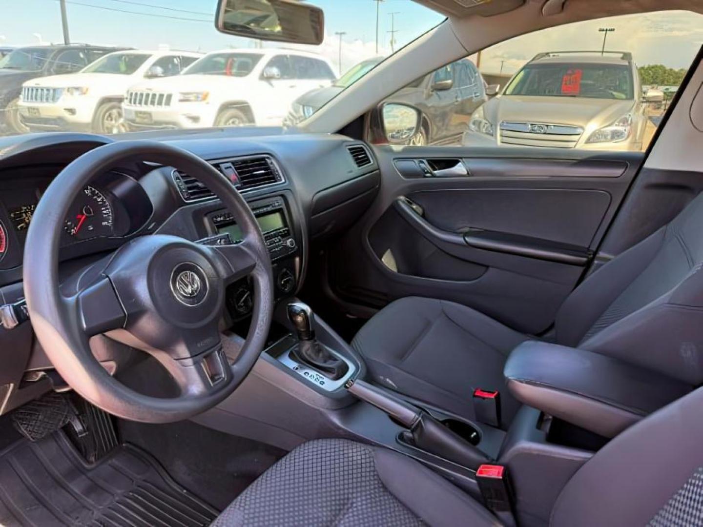 2014 Tornado Red /Titan Black Volkswagen Jetta (3VW2K7AJ5EM) with an 2L I-4 regular unleaded engine, Automatic transmission, located at 1175 N Woodruff Ave, Idaho Falls, ID, 83401, 43.506901, -111.999657 - At Timberline Auto, finding a great deal on your next vehicle is always easy! Our experienced sales staff's goal is to help find you the right vehicle at the right price! Our knowledgeable finance department has options for almost any credit score. We offer extended service contract options to prote - Photo#11