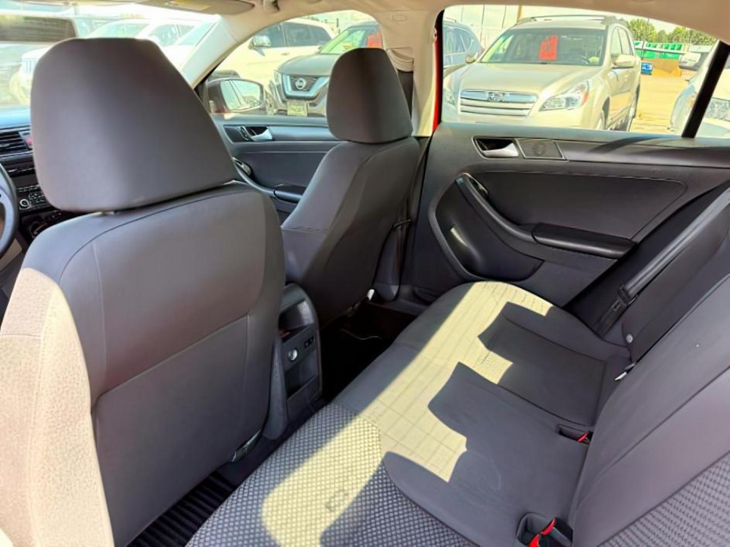 2014 Tornado Red /Titan Black Volkswagen Jetta (3VW2K7AJ5EM) with an 2L I-4 regular unleaded engine, Automatic transmission, located at 1175 N Woodruff Ave, Idaho Falls, ID, 83401, 43.506901, -111.999657 - At Timberline Auto, finding a great deal on your next vehicle is always easy! Our experienced sales staff's goal is to help find you the right vehicle at the right price! Our knowledgeable finance department has options for almost any credit score. We offer extended service contract options to prote - Photo#17