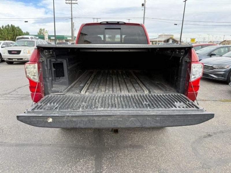 2016 Cayenne Red /Black Nissan Titan XD S (1N6BA1F47GN) with an V8, 5.0L engine, 6-speed automatic transmission, located at 1175 N Woodruff Ave, Idaho Falls, ID, 83401, 43.506901, -111.999657 - <b>Vehicle Details</b><br>Built for hard work and ready for everyday driving, this pre-owned 2016 Nissan Titan XD is a strong choice for drivers seeking capability, comfort, and confidence on the road. Equipped with 4WD and a V8, 5.0L Diesel engine, this Nissan Titan XD delivers impressive towing st- Photo#4