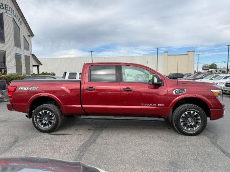 2016 Cayenne Red /Black Nissan Titan XD S (1N6BA1F47GN) with an V8, 5.0L engine, 6-speed automatic transmission, located at 1175 N Woodruff Ave, Idaho Falls, ID, 83401, 43.506901, -111.999657 - <b>Vehicle Details</b><br>Built for hard work and ready for everyday driving, this pre-owned 2016 Nissan Titan XD is a strong choice for drivers seeking capability, comfort, and confidence on the road. Equipped with 4WD and a V8, 5.0L Diesel engine, this Nissan Titan XD delivers impressive towing st- Photo#6