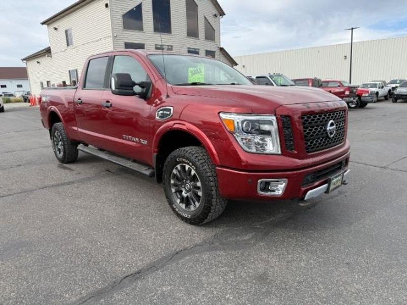 2016 Cayenne Red /Black Nissan Titan XD S (1N6BA1F47GN) with an V8, 5.0L engine, 6-speed automatic transmission, located at 1175 N Woodruff Ave, Idaho Falls, ID, 83401, 43.506901, -111.999657 - <b>Vehicle Details</b><br>Built for hard work and ready for everyday driving, this pre-owned 2016 Nissan Titan XD is a strong choice for drivers seeking capability, comfort, and confidence on the road. Equipped with 4WD and a V8, 5.0L Diesel engine, this Nissan Titan XD delivers impressive towing st- Photo#7