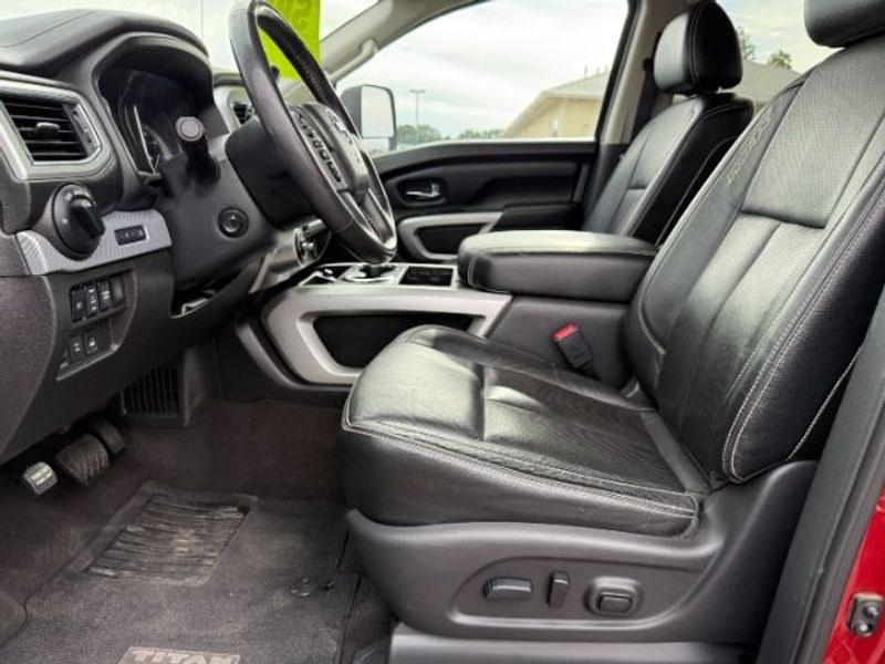 2016 Cayenne Red /Black Nissan Titan XD S (1N6BA1F47GN) with an V8, 5.0L engine, 6-speed automatic transmission, located at 1175 N Woodruff Ave, Idaho Falls, ID, 83401, 43.506901, -111.999657 - <b>Vehicle Details</b><br>Built for hard work and ready for everyday driving, this pre-owned 2016 Nissan Titan XD is a strong choice for drivers seeking capability, comfort, and confidence on the road. Equipped with 4WD and a V8, 5.0L Diesel engine, this Nissan Titan XD delivers impressive towing st- Photo#11