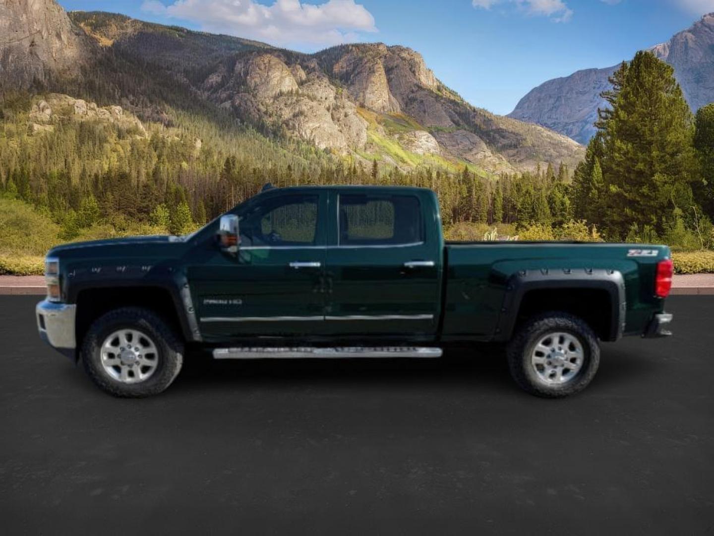 2015 GREEN /Jet Black Chevrolet Silverado 2500HD (1GC1KWE89FF) with an 66 engine, Automatic transmission, located at 1175 N Woodruff Ave, Idaho Falls, ID, 83401, 43.506901, -111.999657 - At Timberline Auto, finding a great deal on your next vehicle is always easy! Our experienced sales staff's goal is to help find you the right vehicle at the right price! Our knowledgeable finance department has options for almost any credit score. We offer extended service contract options to prote - Photo#1