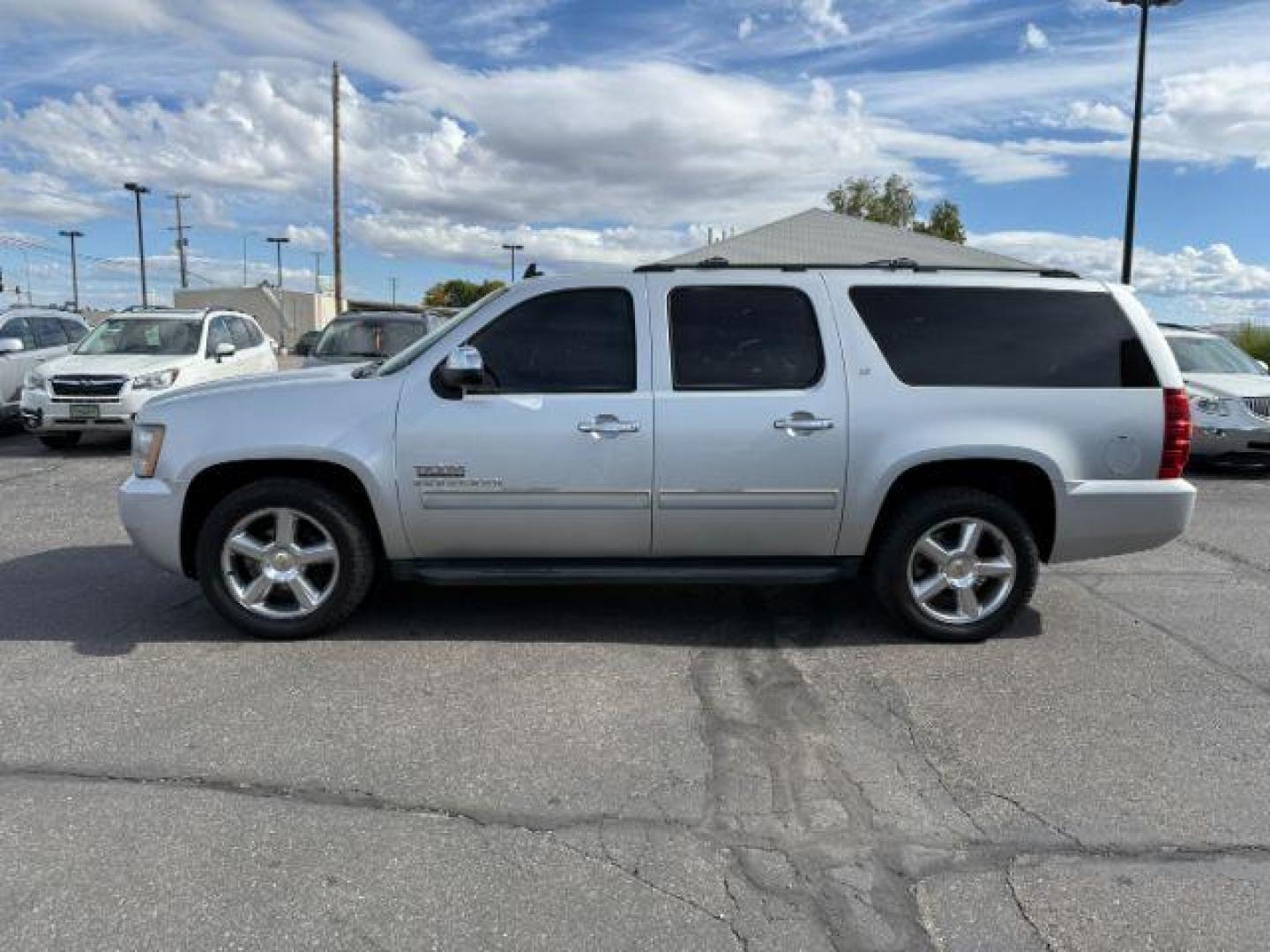 2013 Silver Ice Metallic /Light Cashmere/Dark Cashmere Chevrolet Suburban 1500 (1GNSCJE04DR) with an Vortec 53L V-8 variable valve control engine, Automatic transmission, located at 1175 N Woodruff Ave, Idaho Falls, ID, 83401, 43.506901, -111.999657 - At Timberline Auto, finding a great deal on your next vehicle is always easy! Our experienced sales staff's goal is to help find you the right vehicle at the right price! Our knowledgeable finance department has options for almost any credit score. We offer extended service contract options to prote - Photo#24