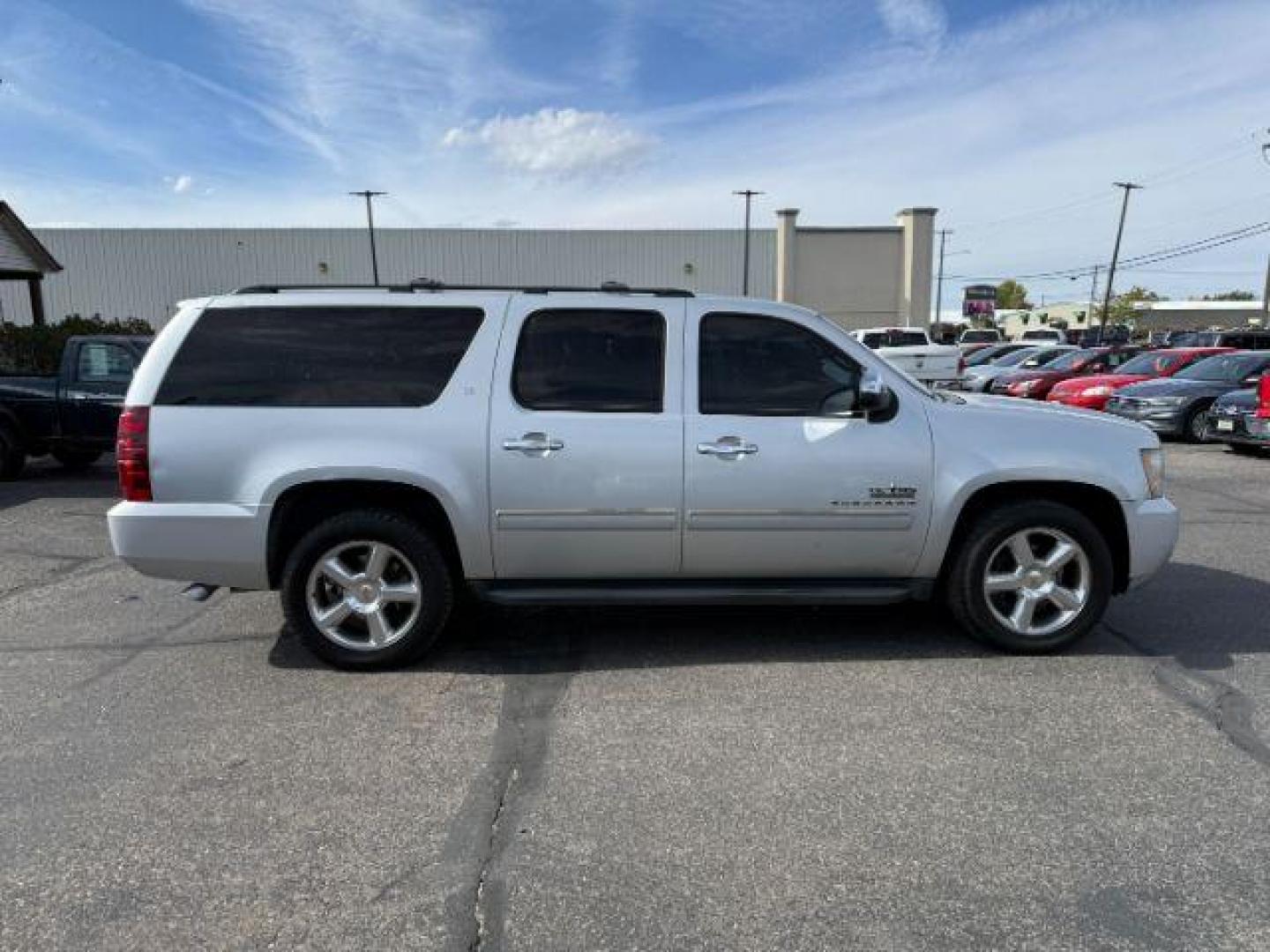 2013 Silver Ice Metallic /Light Cashmere/Dark Cashmere Chevrolet Suburban 1500 (1GNSCJE04DR) with an Vortec 53L V-8 variable valve control engine, Automatic transmission, located at 1175 N Woodruff Ave, Idaho Falls, ID, 83401, 43.506901, -111.999657 - At Timberline Auto, finding a great deal on your next vehicle is always easy! Our experienced sales staff's goal is to help find you the right vehicle at the right price! Our knowledgeable finance department has options for almost any credit score. We offer extended service contract options to prote - Photo#29