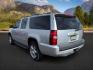 2013 Silver Ice Metallic /Light Cashmere/Dark Cashmere Chevrolet Suburban 1500 (1GNSCJE04DR) with an Vortec 53L V-8 variable valve control engine, Automatic transmission, located at 1175 N Woodruff Ave, Idaho Falls, ID, 83401, 43.506901, -111.999657 - At Timberline Auto, finding a great deal on your next vehicle is always easy! Our experienced sales staff's goal is to help find you the right vehicle at the right price! Our knowledgeable finance department has options for almost any credit score. We offer extended service contract options to prote - Photo#3