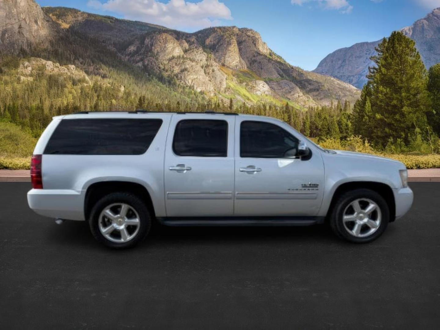 2013 Silver Ice Metallic /Light Cashmere/Dark Cashmere Chevrolet Suburban 1500 (1GNSCJE04DR) with an Vortec 53L V-8 variable valve control engine, Automatic transmission, located at 1175 N Woodruff Ave, Idaho Falls, ID, 83401, 43.506901, -111.999657 - At Timberline Auto, finding a great deal on your next vehicle is always easy! Our experienced sales staff's goal is to help find you the right vehicle at the right price! Our knowledgeable finance department has options for almost any credit score. We offer extended service contract options to prote - Photo#7