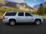 2013 Silver Ice Metallic /Light Cashmere/Dark Cashmere Chevrolet Suburban 1500 (1GNSCJE04DR) with an Vortec 53L V-8 variable valve control engine, Automatic transmission, located at 1175 N Woodruff Ave, Idaho Falls, ID, 83401, 43.506901, -111.999657 - At Timberline Auto, finding a great deal on your next vehicle is always easy! Our experienced sales staff's goal is to help find you the right vehicle at the right price! Our knowledgeable finance department has options for almost any credit score. We offer extended service contract options to prote - Photo#7