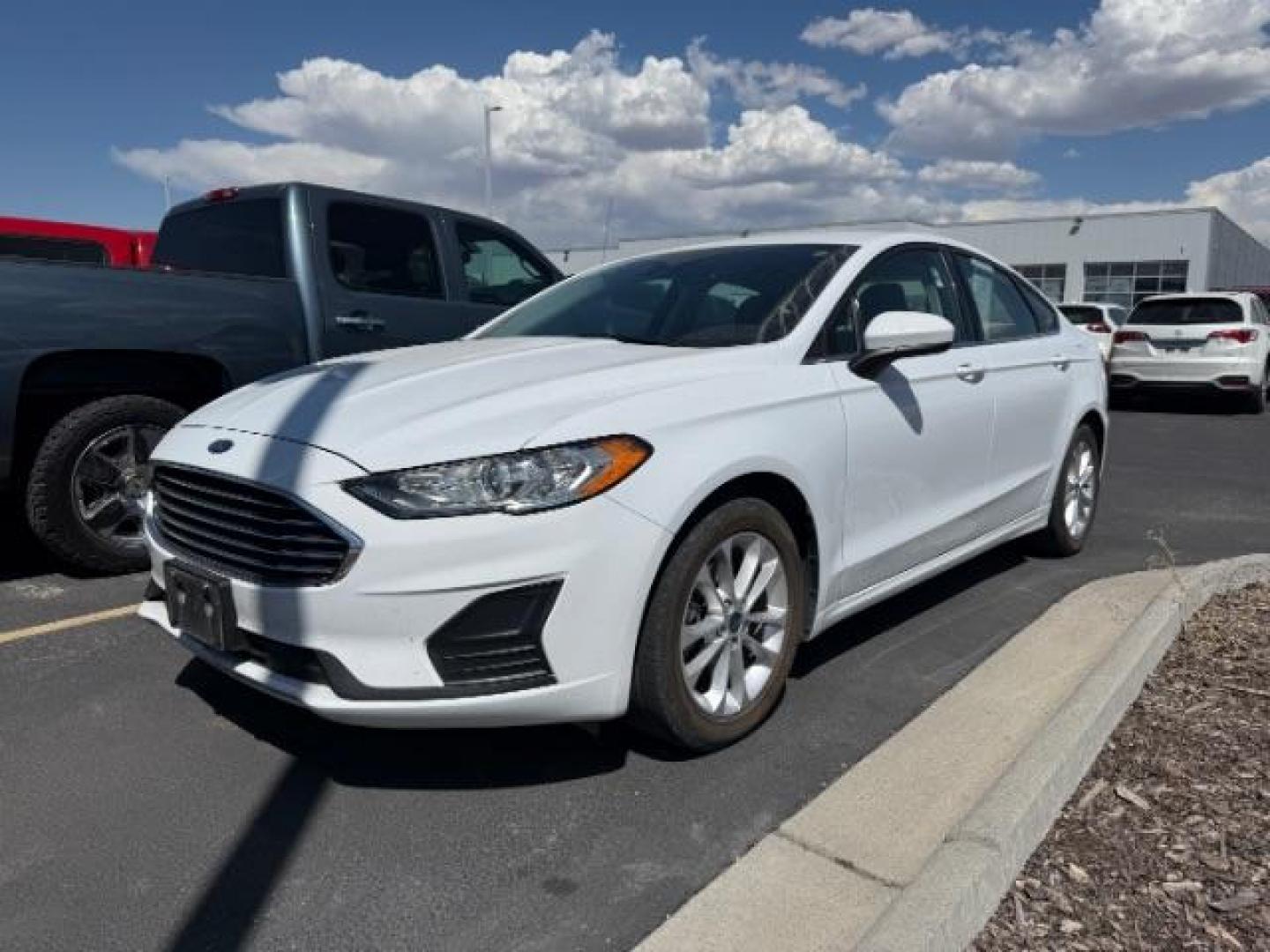 2019 Oxford White /Ebony Ford Fusion SE (3FA6P0HD1KR) with an EcoBoost 1.5L I-4 gasoline direct injection engine, AUTOMATIC transmission, located at 1235 N Woodruff Ave., Idaho Falls, 83401, (208) 523-1053, 43.507172, -112.000488 - At Timberline Auto, finding a great deal on your next vehicle is always easy! Our experienced sales staff's goal is to help find you the right vehicle at the right price! Our knowledgeable finance department has options for almost any credit score. We offer extended service contract options to prote - Photo#0