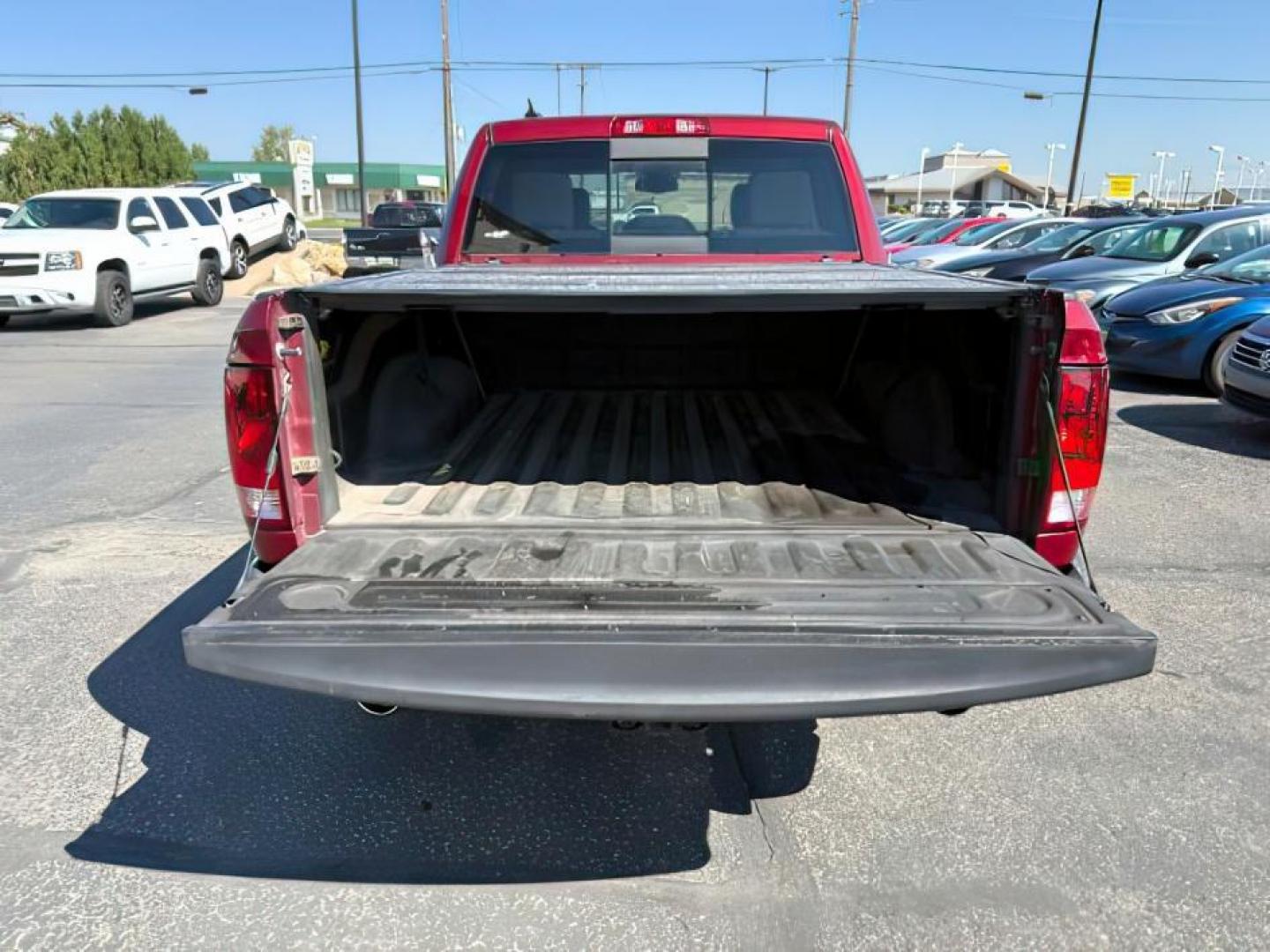 2015 RED /Diesel Gray/Black Ram 1500 (1C6RR7LTXFS) with an HEMI 57L V-8 variable valve control engine, Automatic transmission, located at 1175 N Woodruff Ave, Idaho Falls, ID, 83401, 43.506901, -111.999657 - At Timberline Auto, finding a great deal on your next vehicle is always easy! Our experienced sales staff's goal is to help find you the right vehicle at the right price! Our knowledgeable finance department has options for almost any credit score. We offer extended service contract options to prote - Photo#4