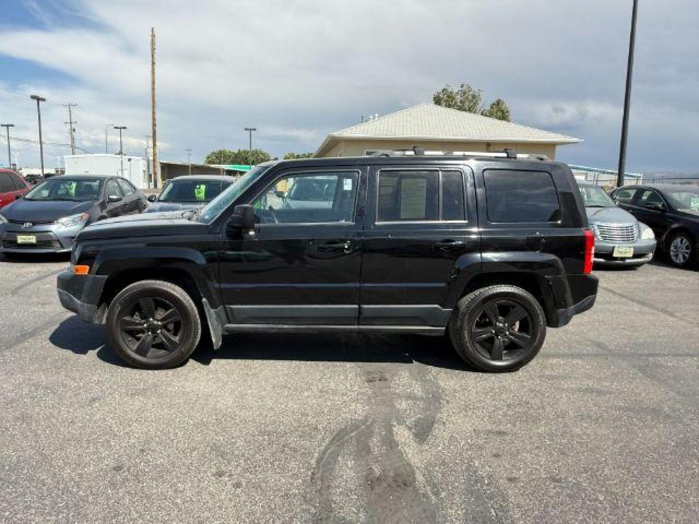 2012 Black /Dark Slate Gray Cloth Interior Jeep Patriot (1C4NJRFB6CD) with an 24L L4 DOHC 16V engine, located at 1175 N Woodruff Ave, Idaho Falls, ID, 83401, 43.506901, -111.999657 - Photo#20