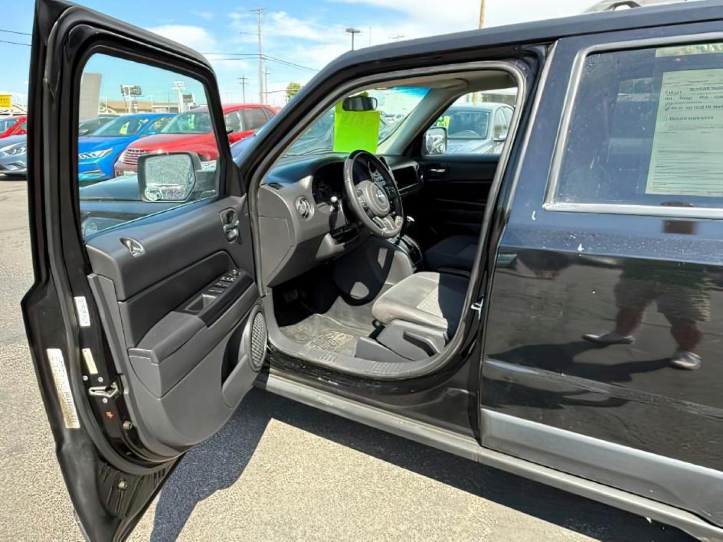 2012 Black /Dark Slate Gray Cloth Interior Jeep Patriot (1C4NJRFB6CD) with an 24L L4 DOHC 16V engine, located at 1175 N Woodruff Ave, Idaho Falls, ID, 83401, 43.506901, -111.999657 - Photo#10