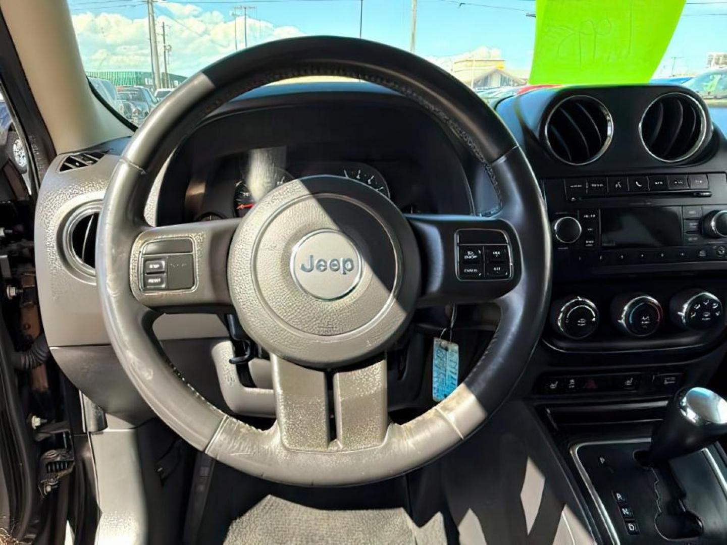 2012 Black /Dark Slate Gray Cloth Interior Jeep Patriot (1C4NJRFB6CD) with an 24L L4 DOHC 16V engine, located at 1175 N Woodruff Ave, Idaho Falls, ID, 83401, 43.506901, -111.999657 - Photo#13