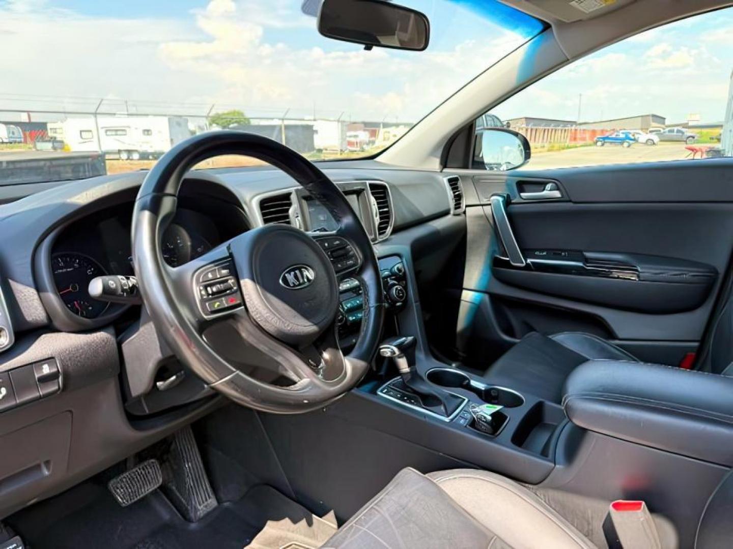 2019 BLACK /Black KIA Sportage (KNDPNCAC0K7) with an Theta II 24L I-4 gasoline direct injection engine, Automatic transmission, located at 1175 N Woodruff Ave, Idaho Falls, ID, 83401, 43.506901, -111.999657 - At Timberline Auto, finding a great deal on your next vehicle is always easy! Our experienced sales staff's goal is to help find you the right vehicle at the right price! Our knowledgeable finance department has options for almost any credit score. We offer extended service contract options to prote - Photo#13
