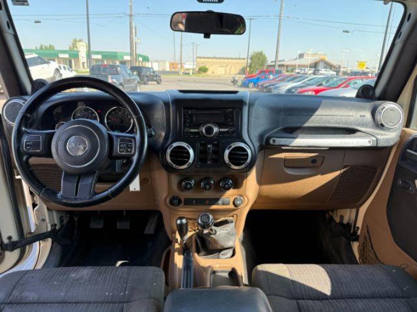 2012 TAN /CLOTH Jeep WRANGLER (1C4BJWEG2CL) with an 36 engine, Manual transmission, located at 1175 N Woodruff Ave, Idaho Falls, ID, 83401, 43.506901, -111.999657 - At Timberline Auto, finding a great deal on your next vehicle is always easy! Our experienced sales staff's goal is to help find you the right vehicle at the right price! Our knowledgeable finance department has options for almost any credit score. We offer extended service contract options to prote - Photo#37