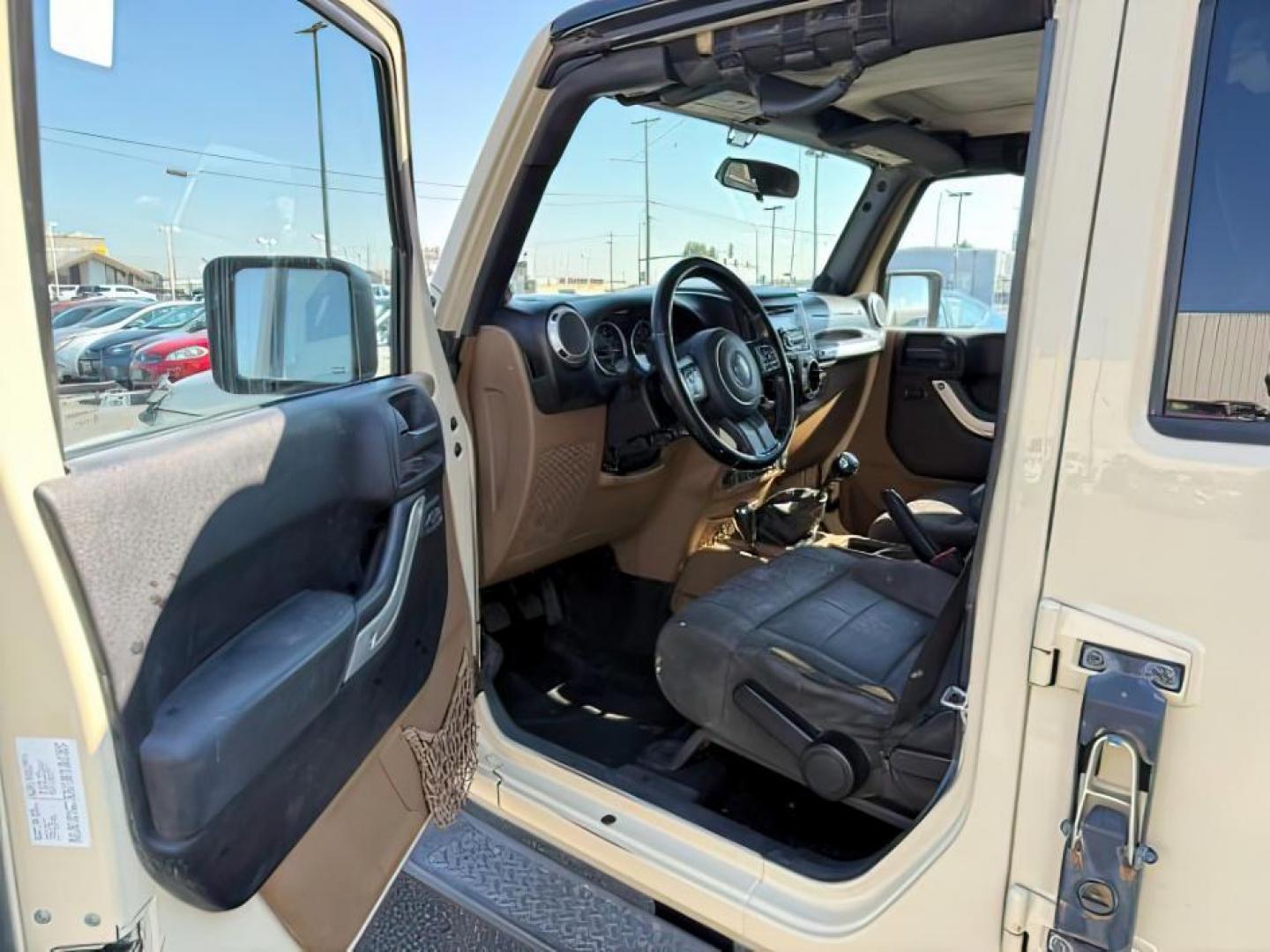 2012 TAN /CLOTH Jeep WRANGLER (1C4BJWEG2CL) with an 36 engine, Manual transmission, located at 1175 N Woodruff Ave, Idaho Falls, ID, 83401, 43.506901, -111.999657 - At Timberline Auto, finding a great deal on your next vehicle is always easy! Our experienced sales staff's goal is to help find you the right vehicle at the right price! Our knowledgeable finance department has options for almost any credit score. We offer extended service contract options to prote - Photo#10