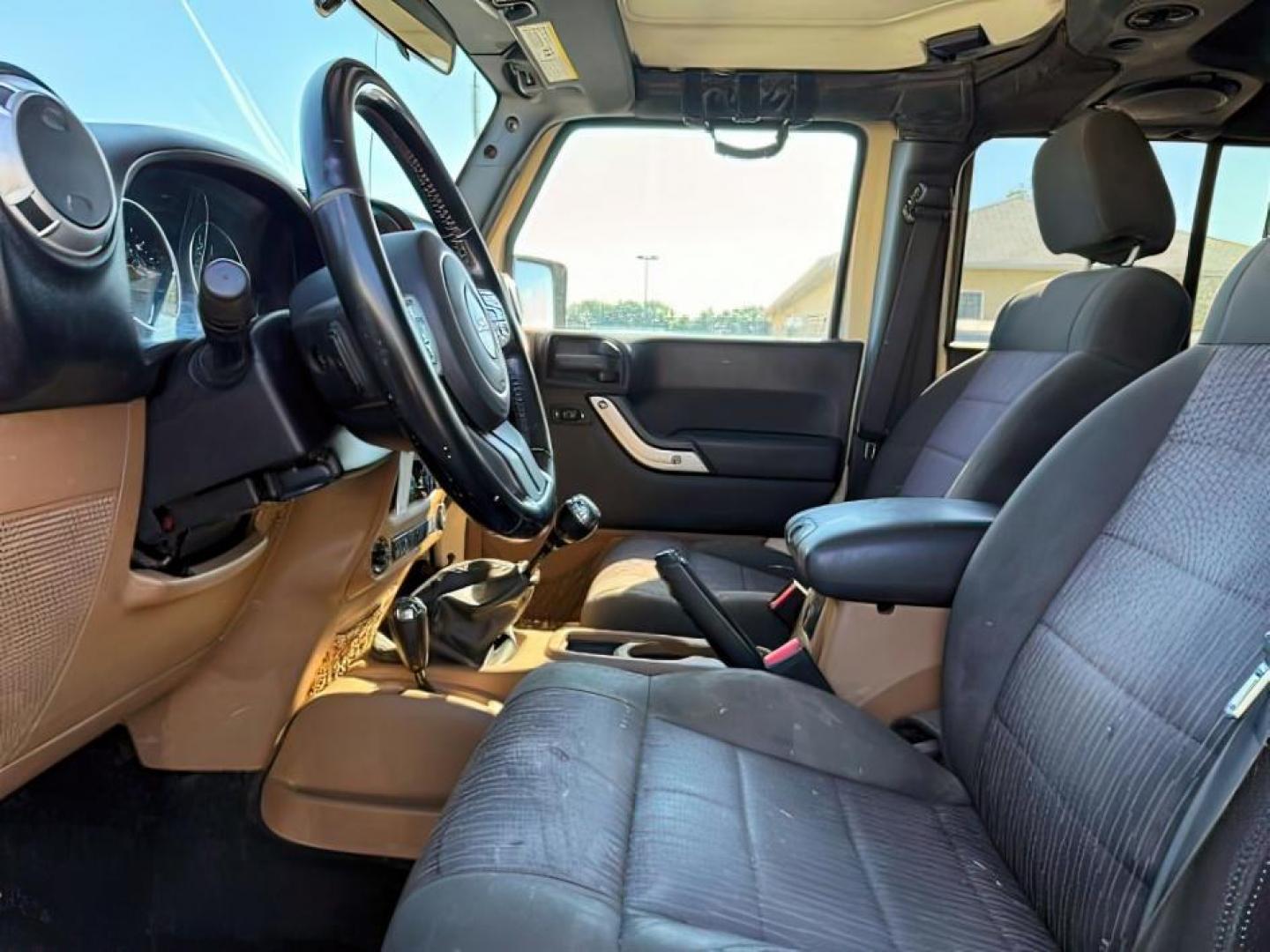 2012 TAN /CLOTH Jeep WRANGLER (1C4BJWEG2CL) with an 36 engine, Manual transmission, located at 1175 N Woodruff Ave, Idaho Falls, ID, 83401, 43.506901, -111.999657 - At Timberline Auto, finding a great deal on your next vehicle is always easy! Our experienced sales staff's goal is to help find you the right vehicle at the right price! Our knowledgeable finance department has options for almost any credit score. We offer extended service contract options to prote - Photo#11