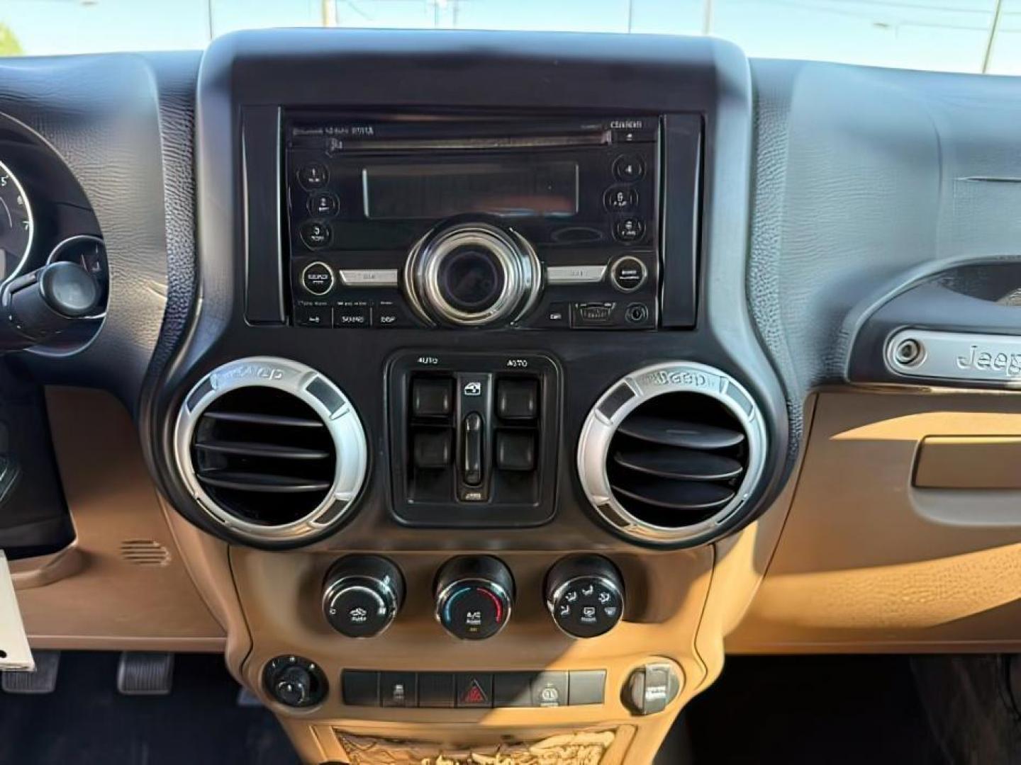 2012 TAN /CLOTH Jeep WRANGLER (1C4BJWEG2CL) with an 36 engine, Manual transmission, located at 1175 N Woodruff Ave, Idaho Falls, ID, 83401, 43.506901, -111.999657 - At Timberline Auto, finding a great deal on your next vehicle is always easy! Our experienced sales staff's goal is to help find you the right vehicle at the right price! Our knowledgeable finance department has options for almost any credit score. We offer extended service contract options to prote - Photo#14